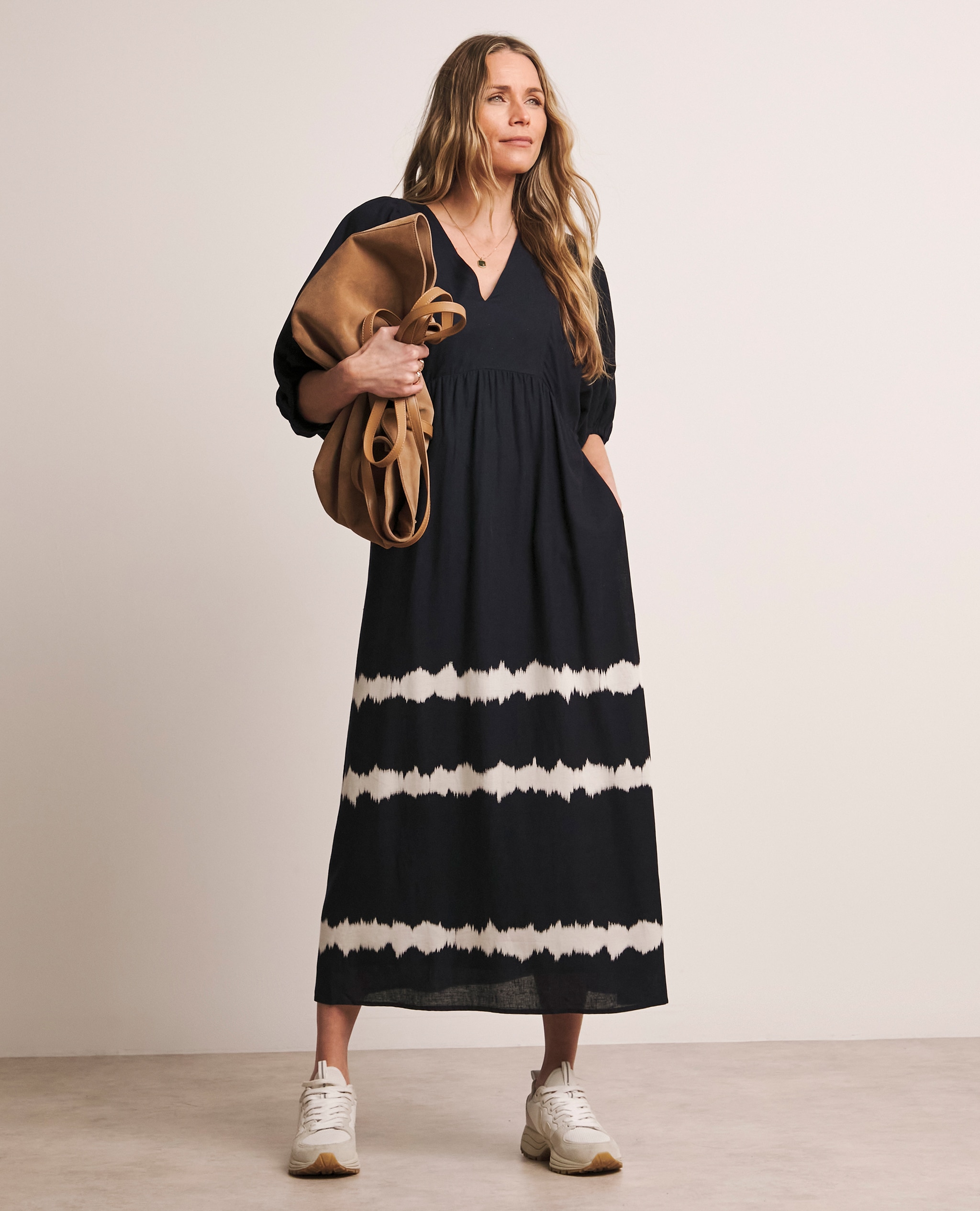 Model wears Anthology Puff Sleeve Dress in Navy Print