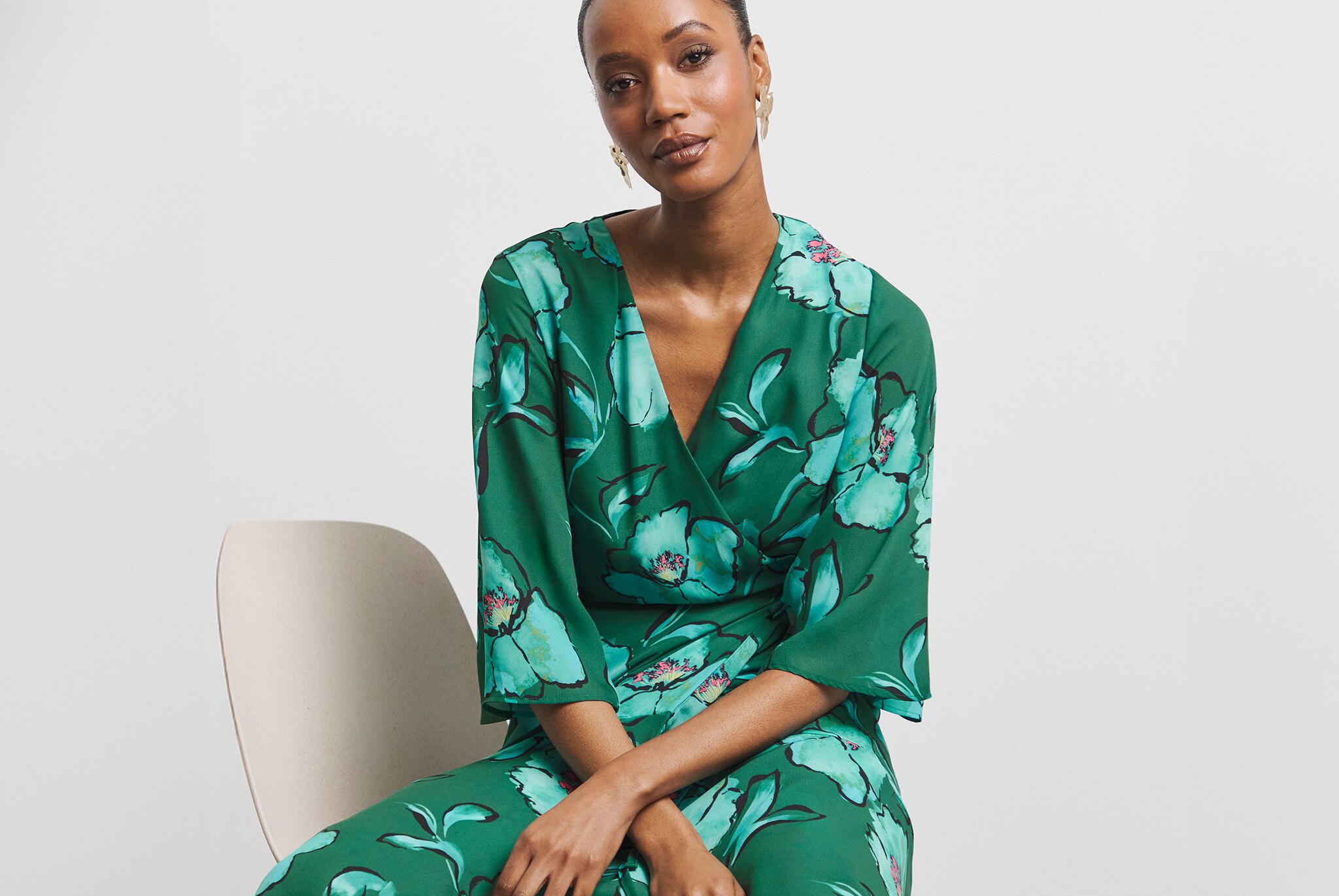 Model wears Joanna Hope Printed Wrap Dress with Angel Sleeves