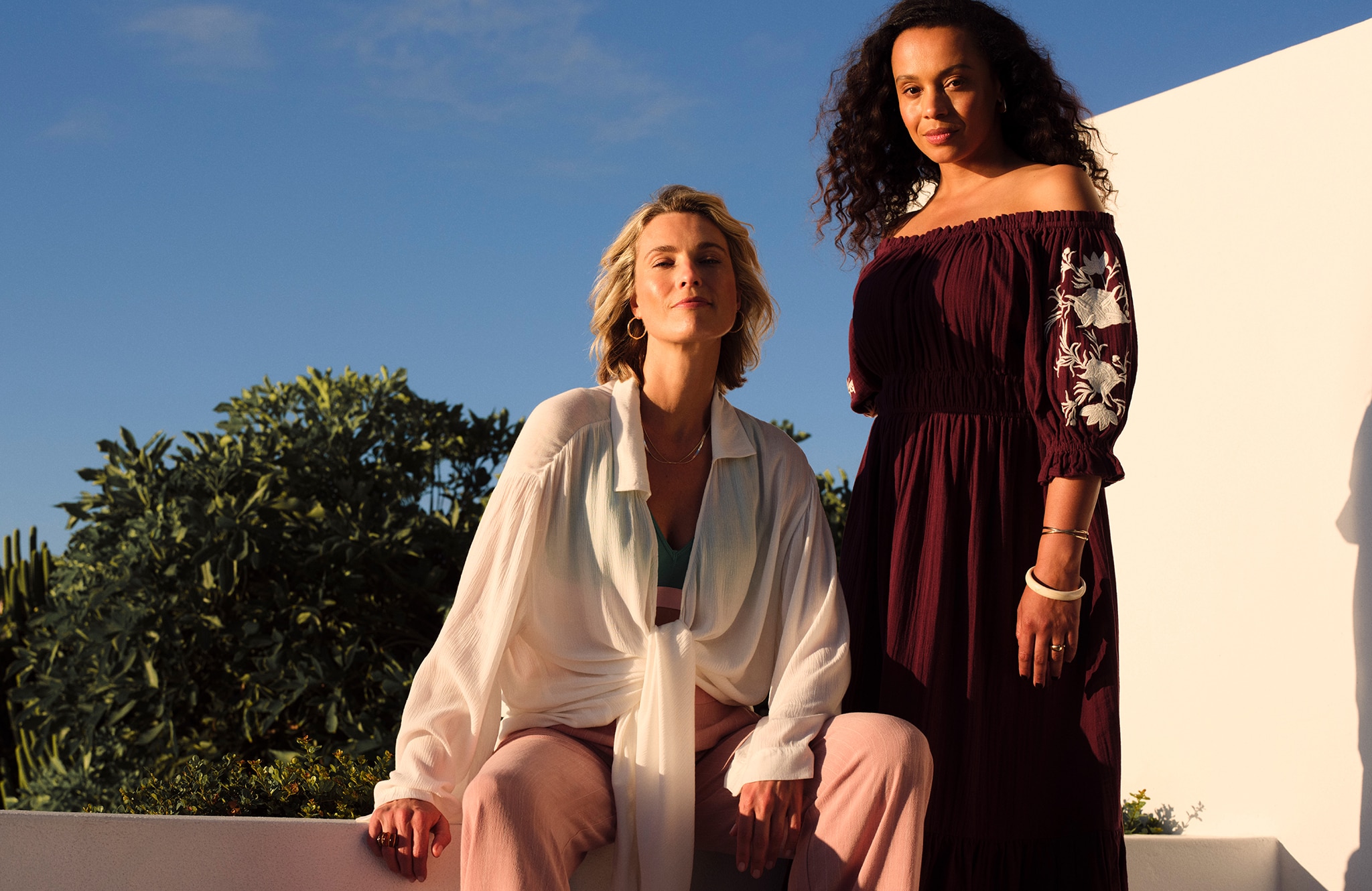 Models wear evening outfits from our new season range