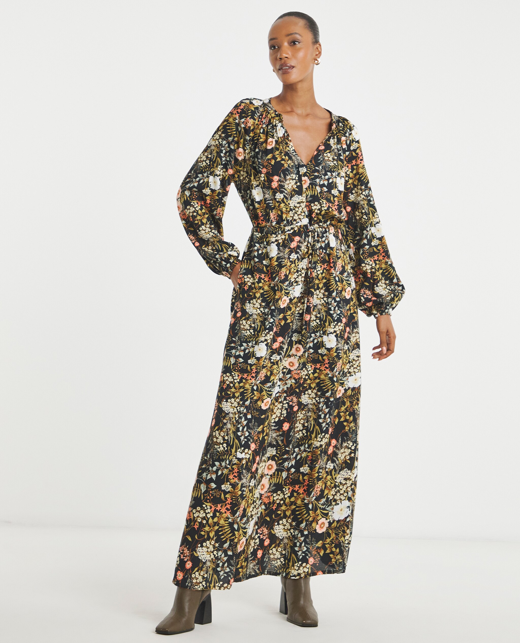 Model wears Long Sleeve Printed Maxi Dress in Black Floral