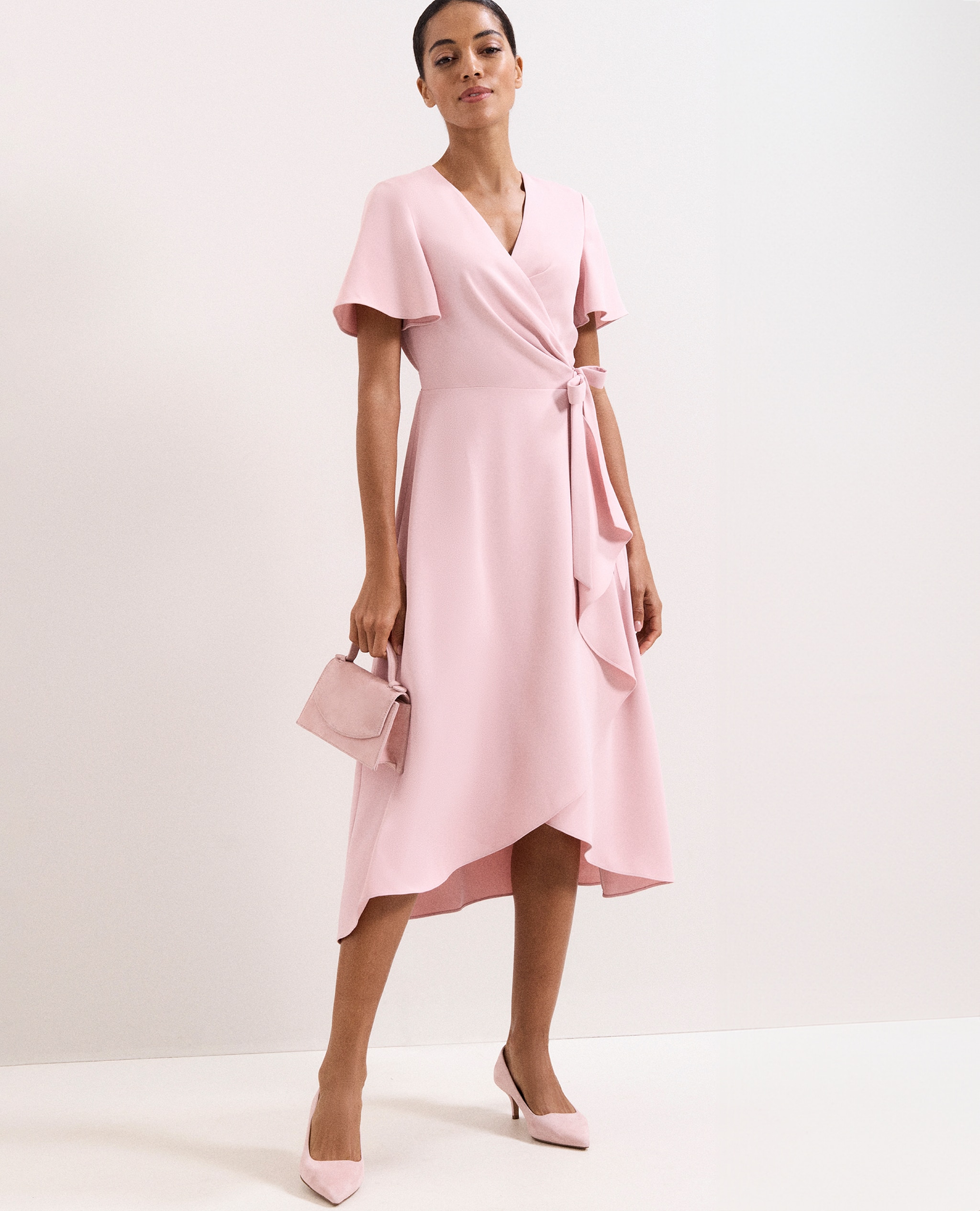 Model wears Phase Eight Julissa Wrap Dress in Pink