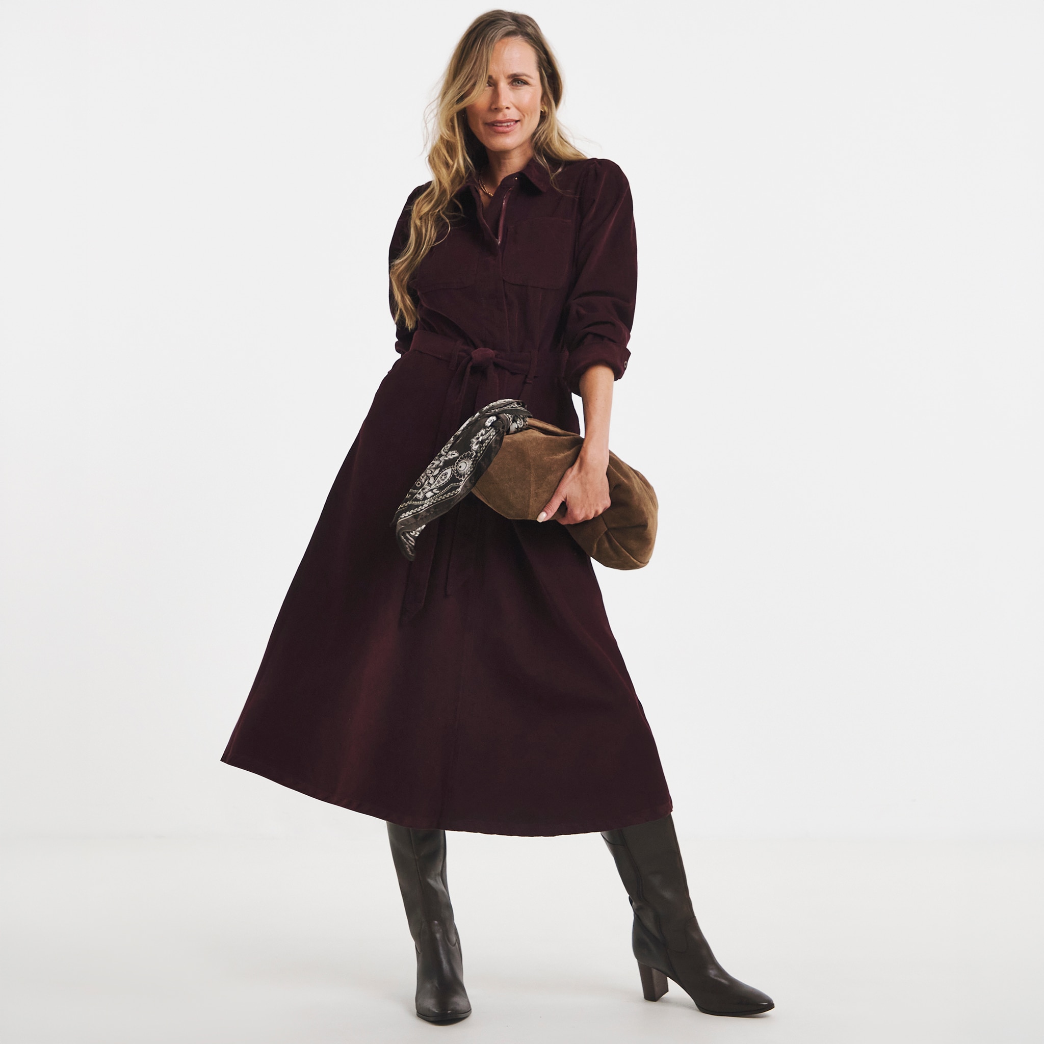 A woman wearing burgundy midi dress.
