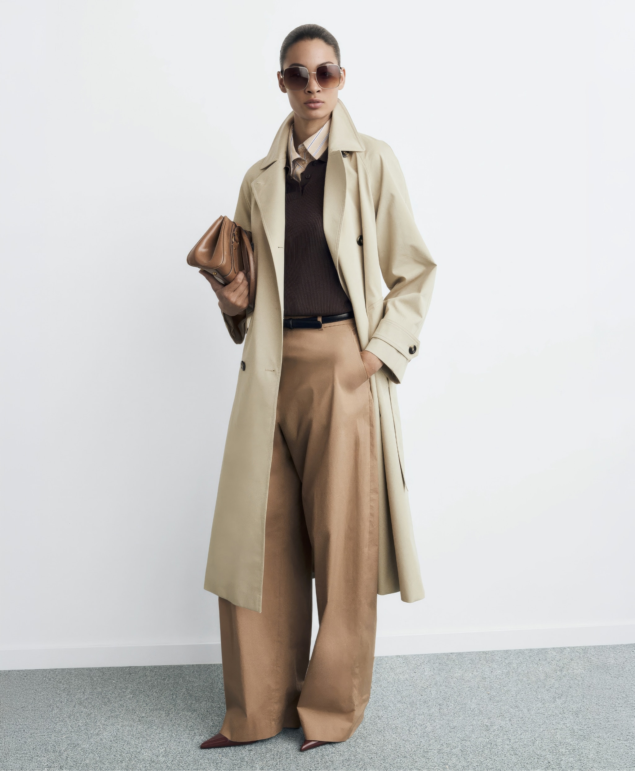 Woman wearing Mango beige trench coat