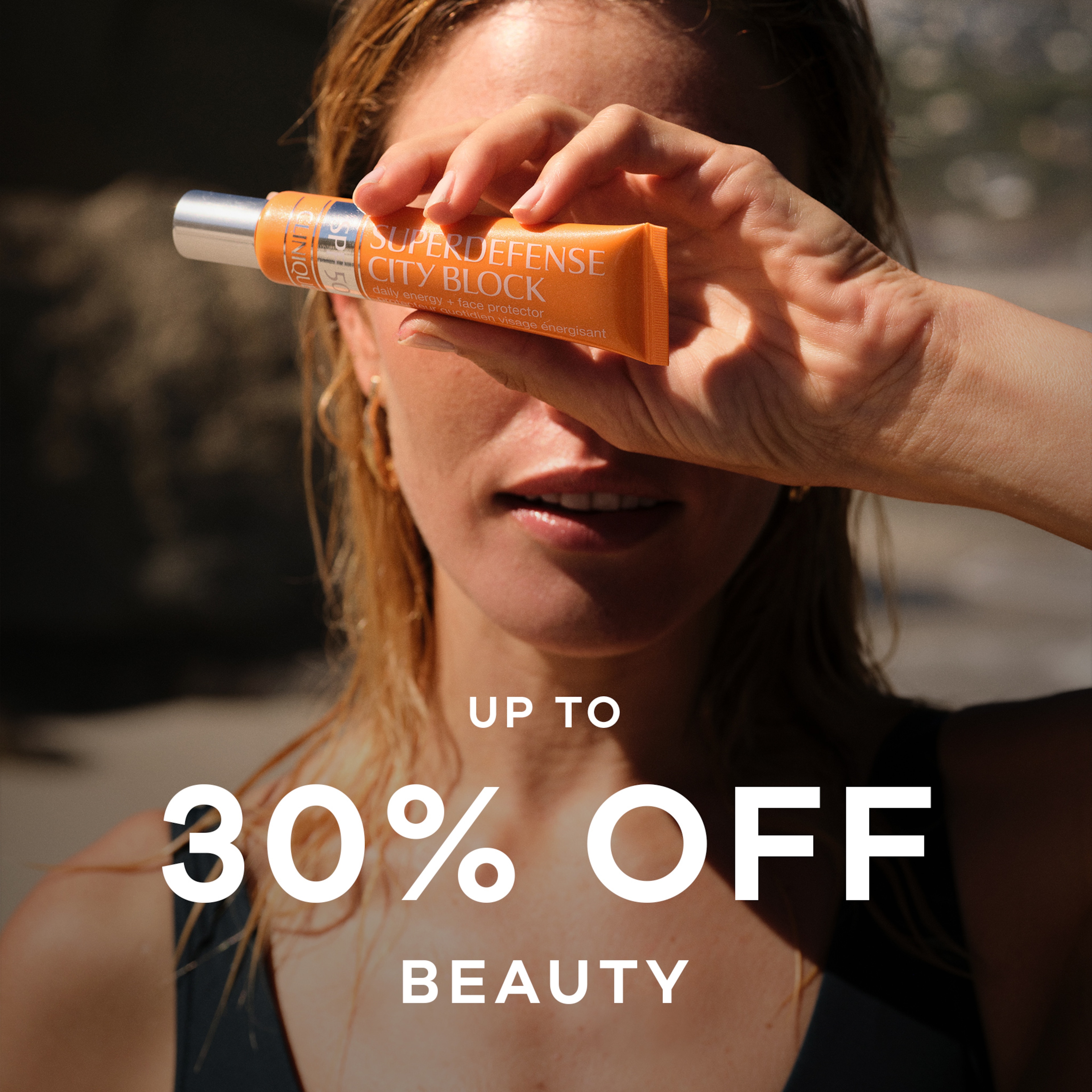 A lady holding a beauty product above her face.
Up to 30% off beauty