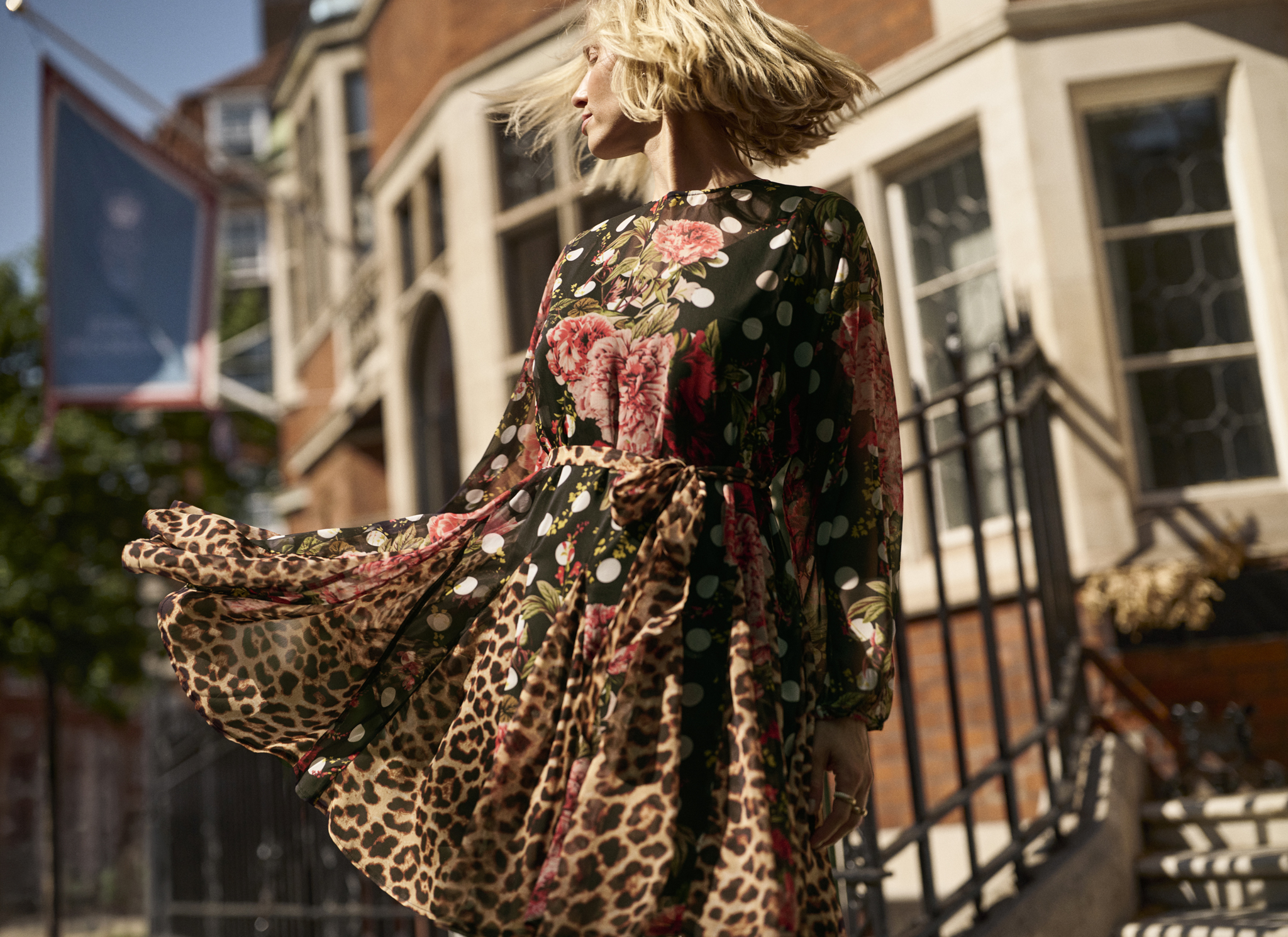 Woman wearing JD Williams dress stood on a London street