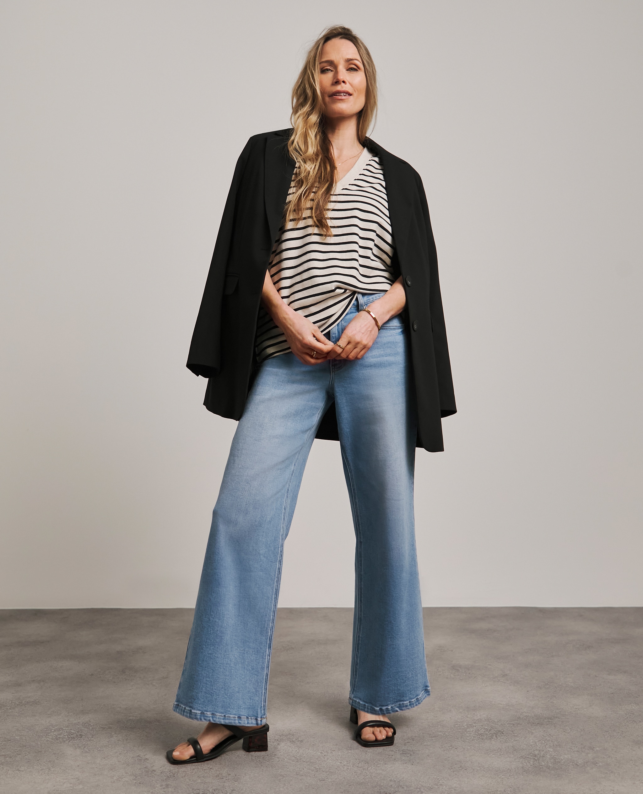 Model wears Anthology Light Blue Wide Leg Jeans