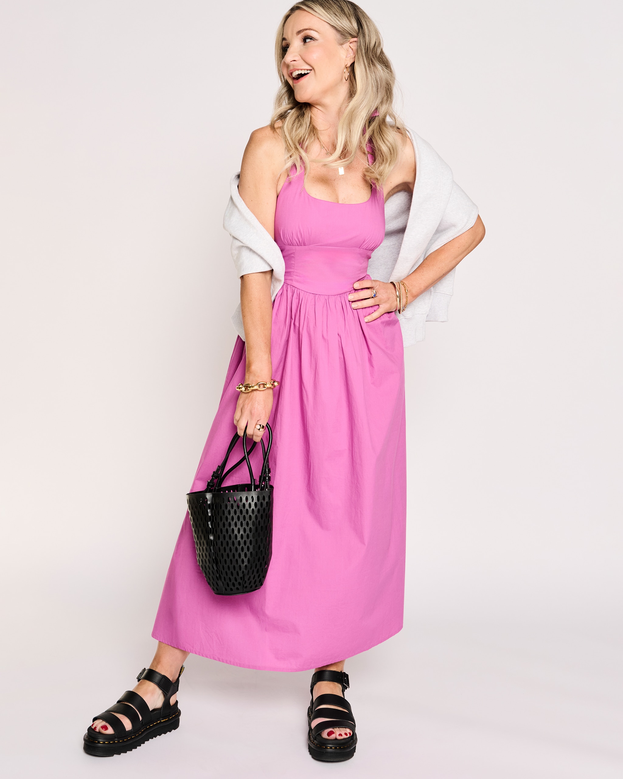 Model is wearing a Nobody's Child Hallie midi dress.