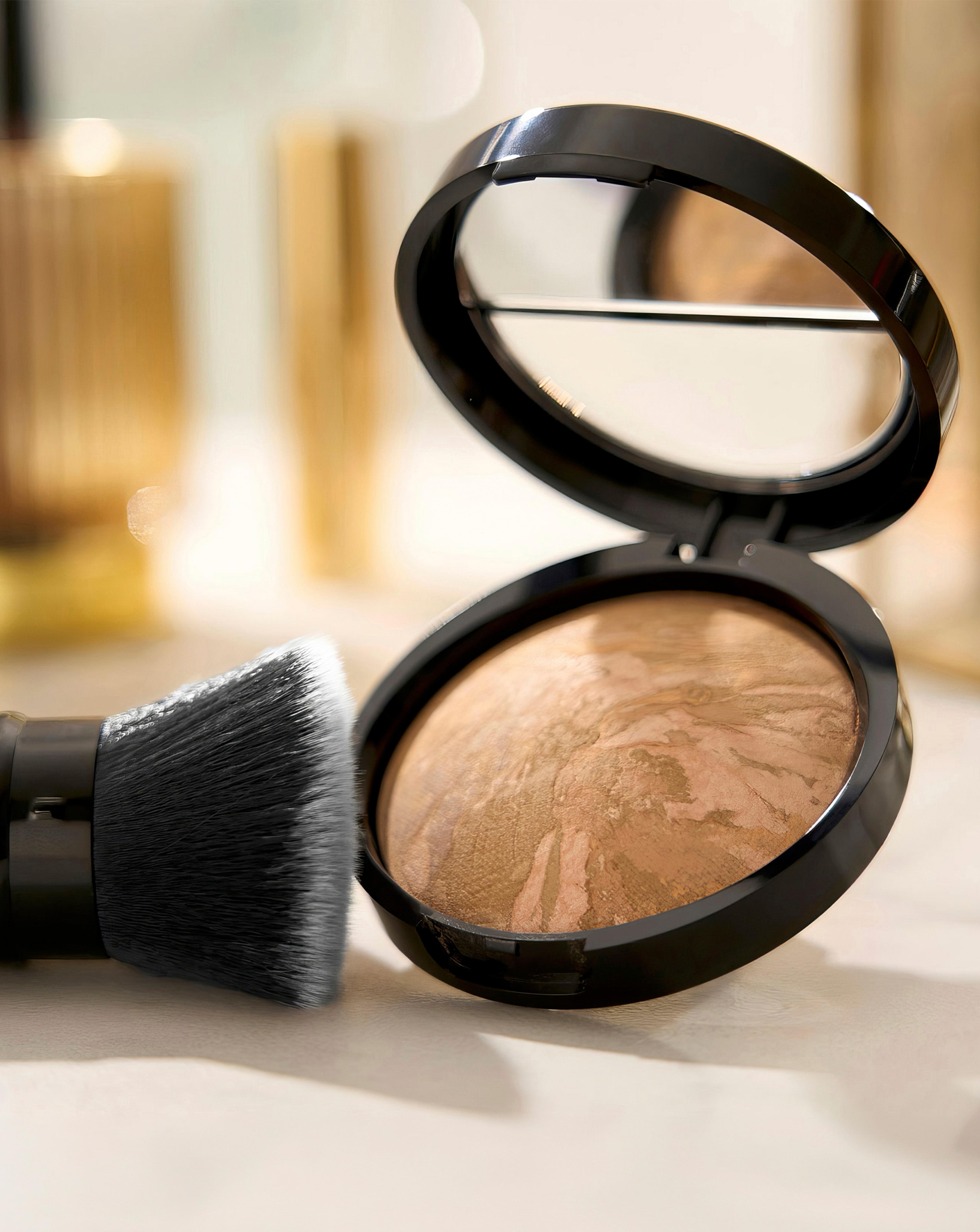 Make up and a brush on a table top.