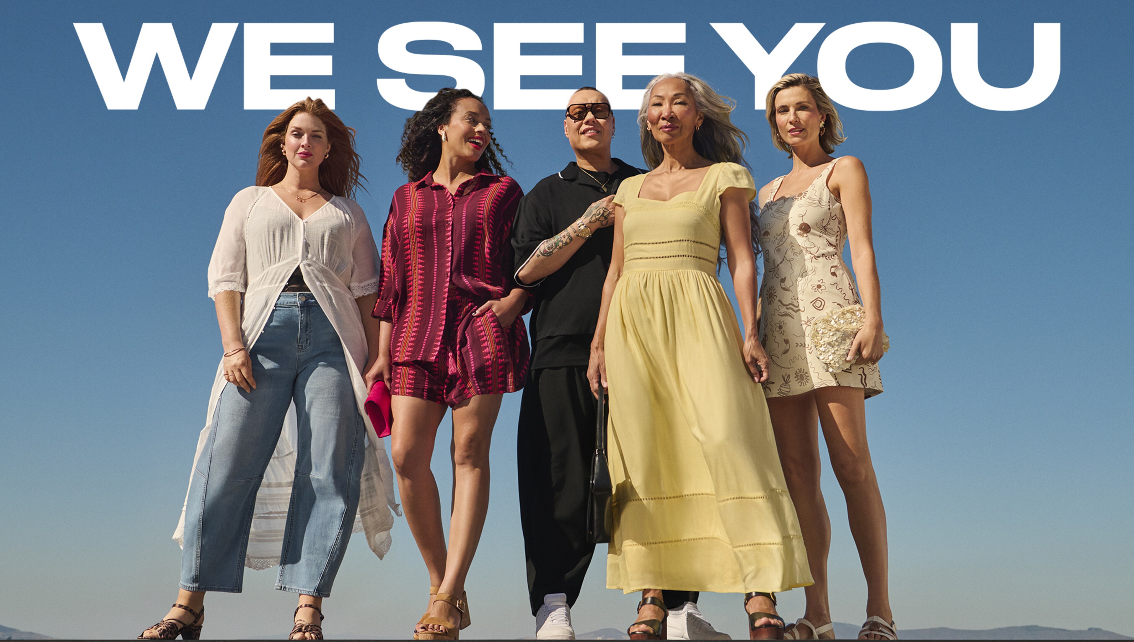 4 ladies and Gok Wan stood wearing holiday clothing. We see you in aid of Macmillan cancer support.