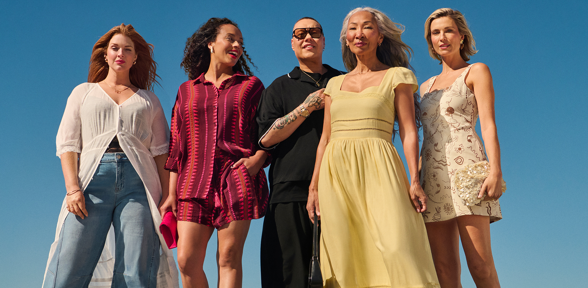 4 ladies and Gok Wan stood wearing holiday clothing. We see you.