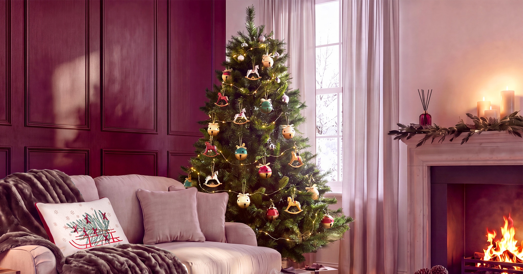 A living room decorated for Christmas with a tree in the corner.
