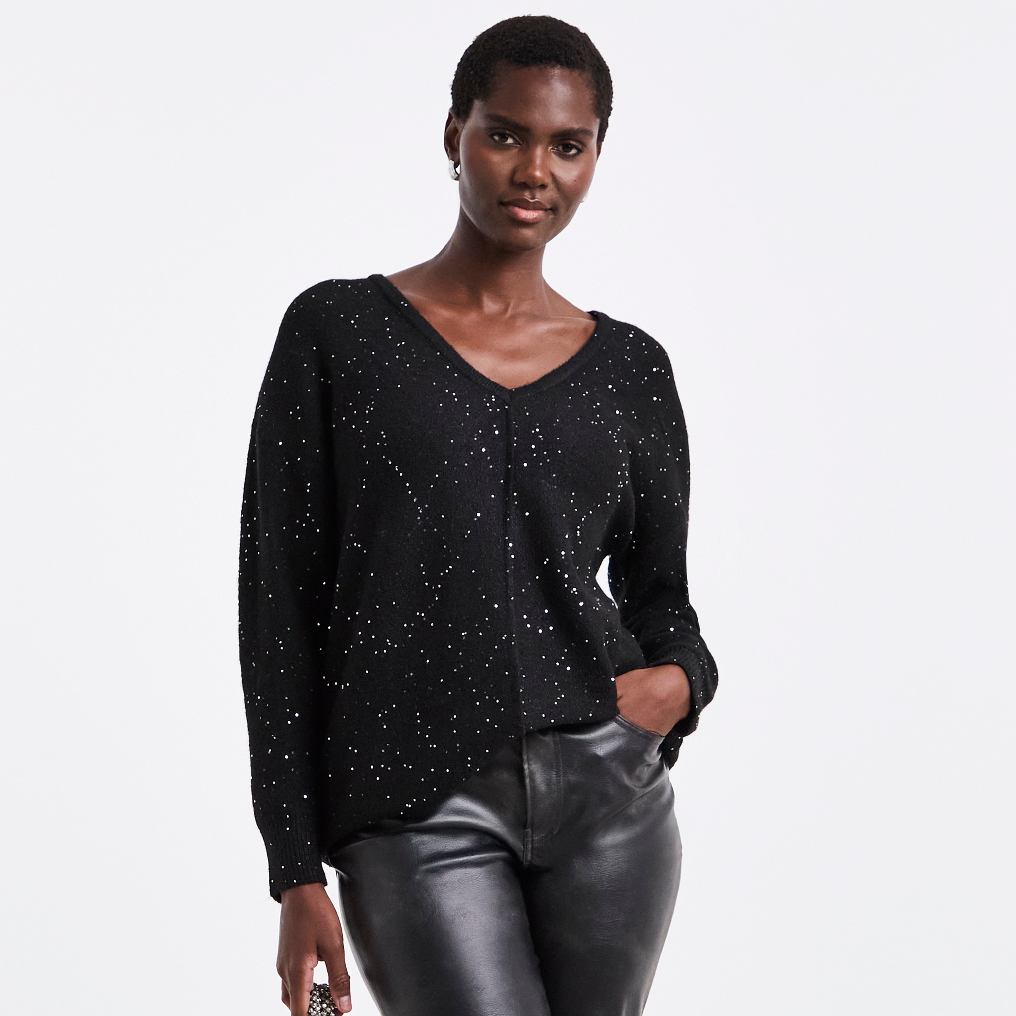 A woman wearing a black jumper.