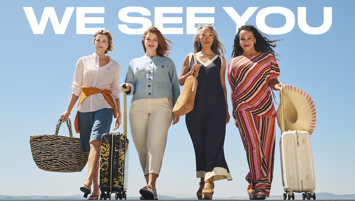 4 ladies walking forwards wearing holiday clothing. We see you in aid of Macmillan cancer support.