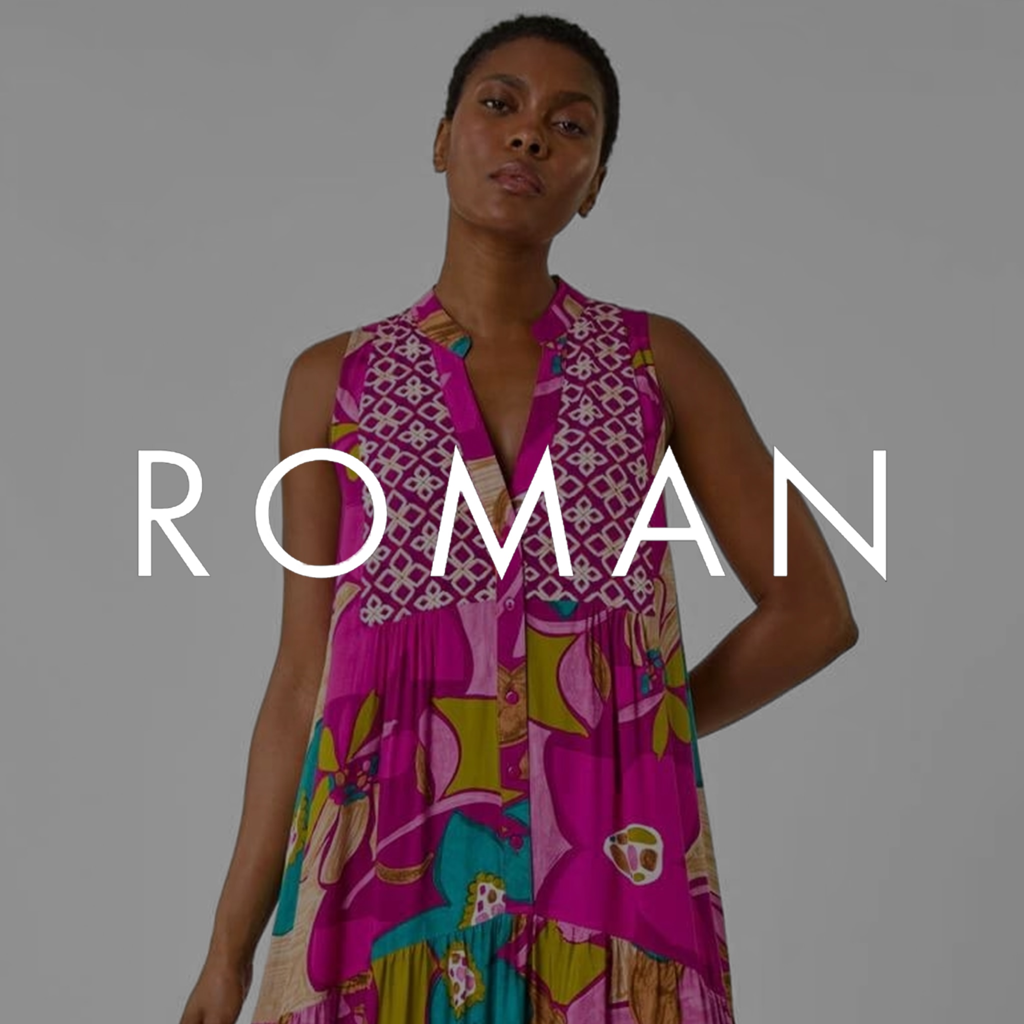 A lady stood wearing a pink ROMAN dress. There's a grey overlay on the image with the ROMAN logo in the centre.