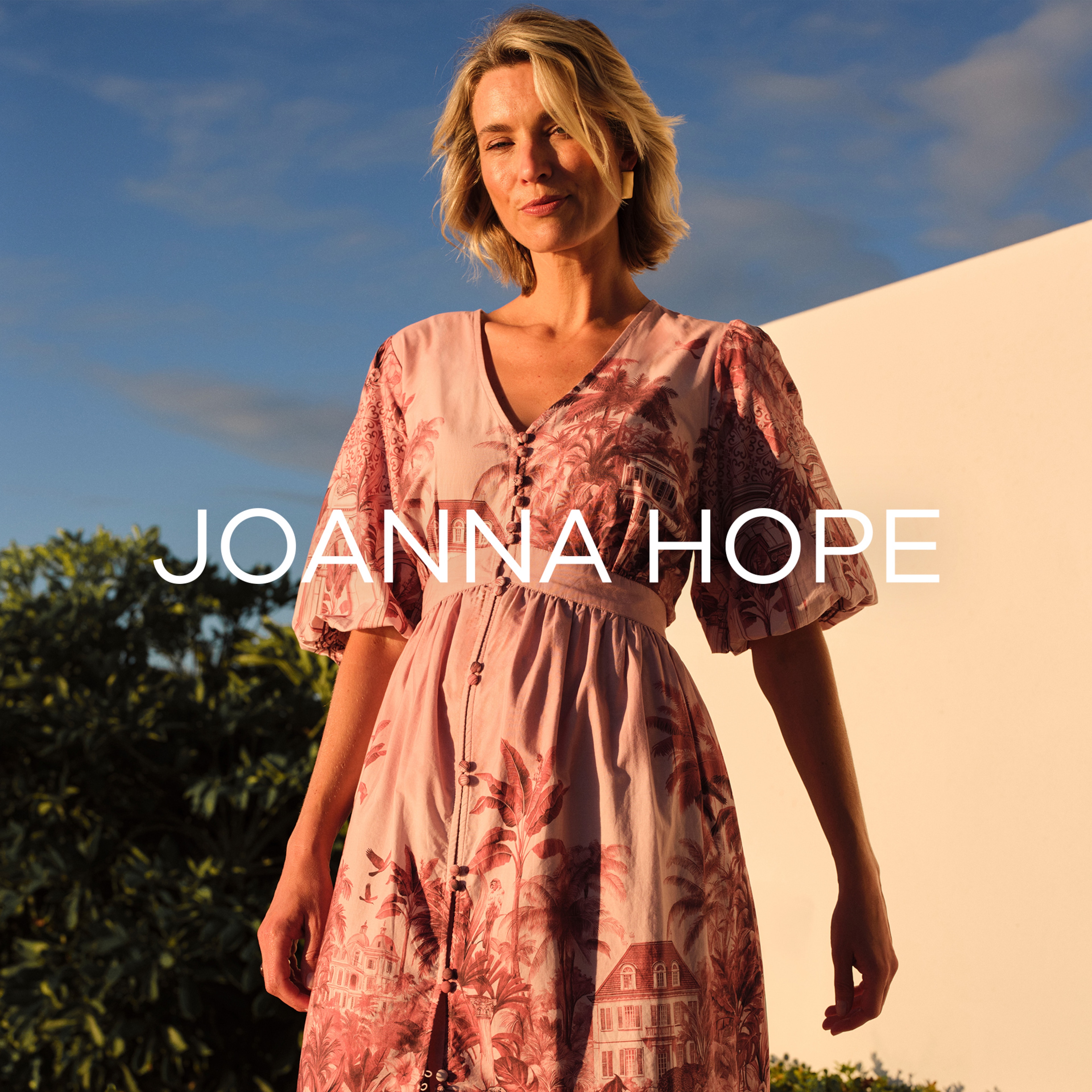 A lady wearing a Joanna Hope Dress.