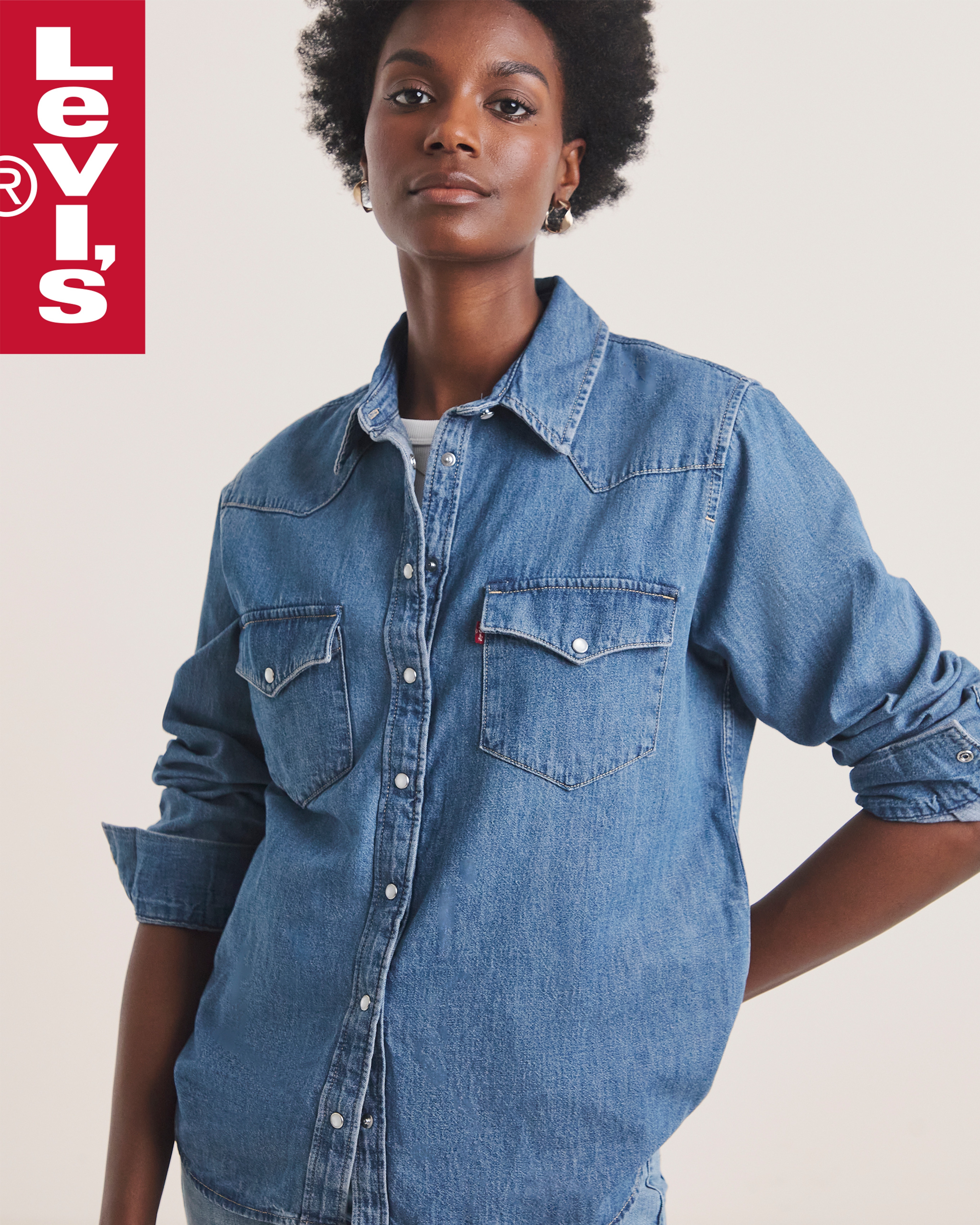 A woman wearing a Levi's denim shirt.