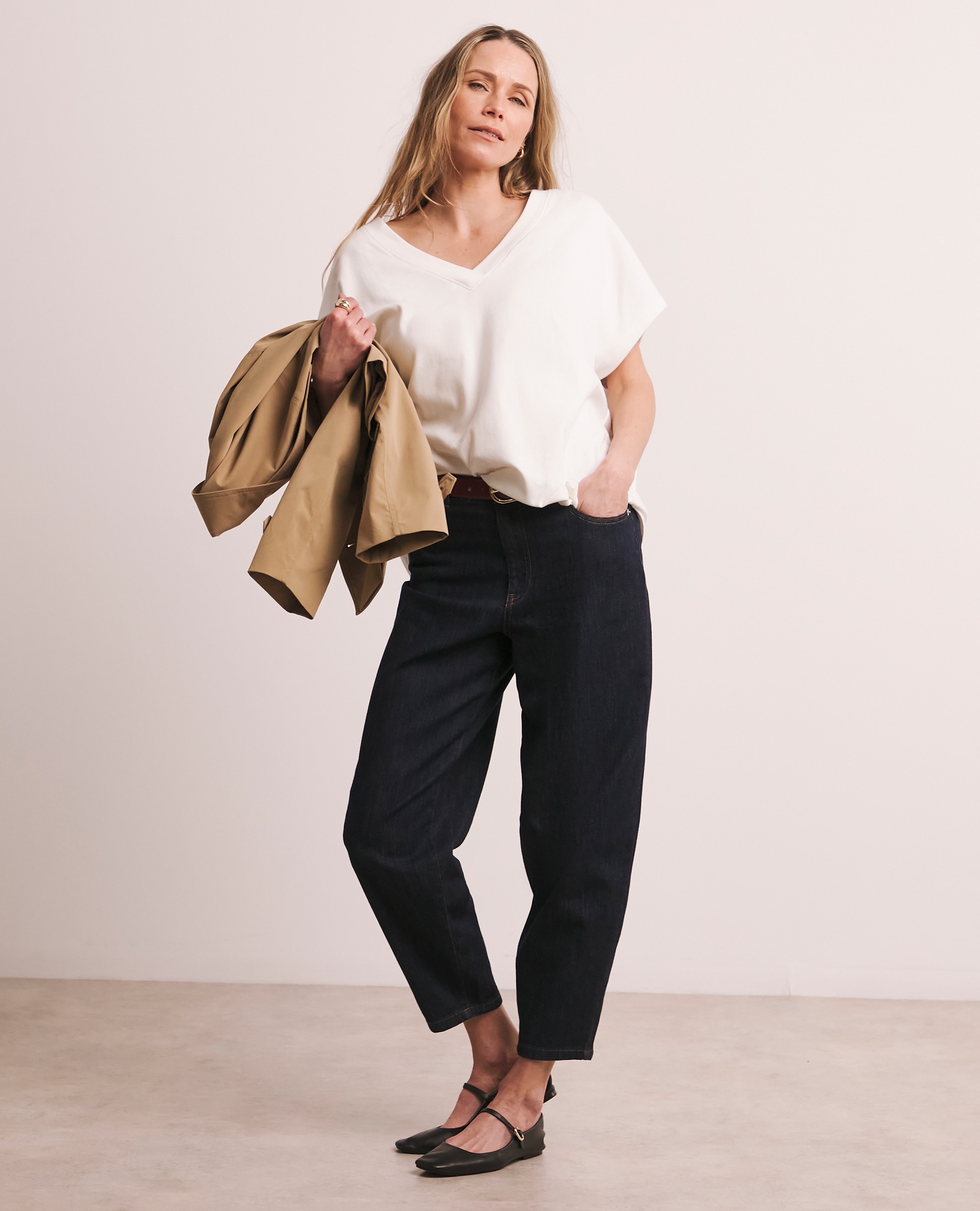 Model wears Anthology V-Neck T-Shirt with 24/7 Dark Blue Wide Crop Jeans