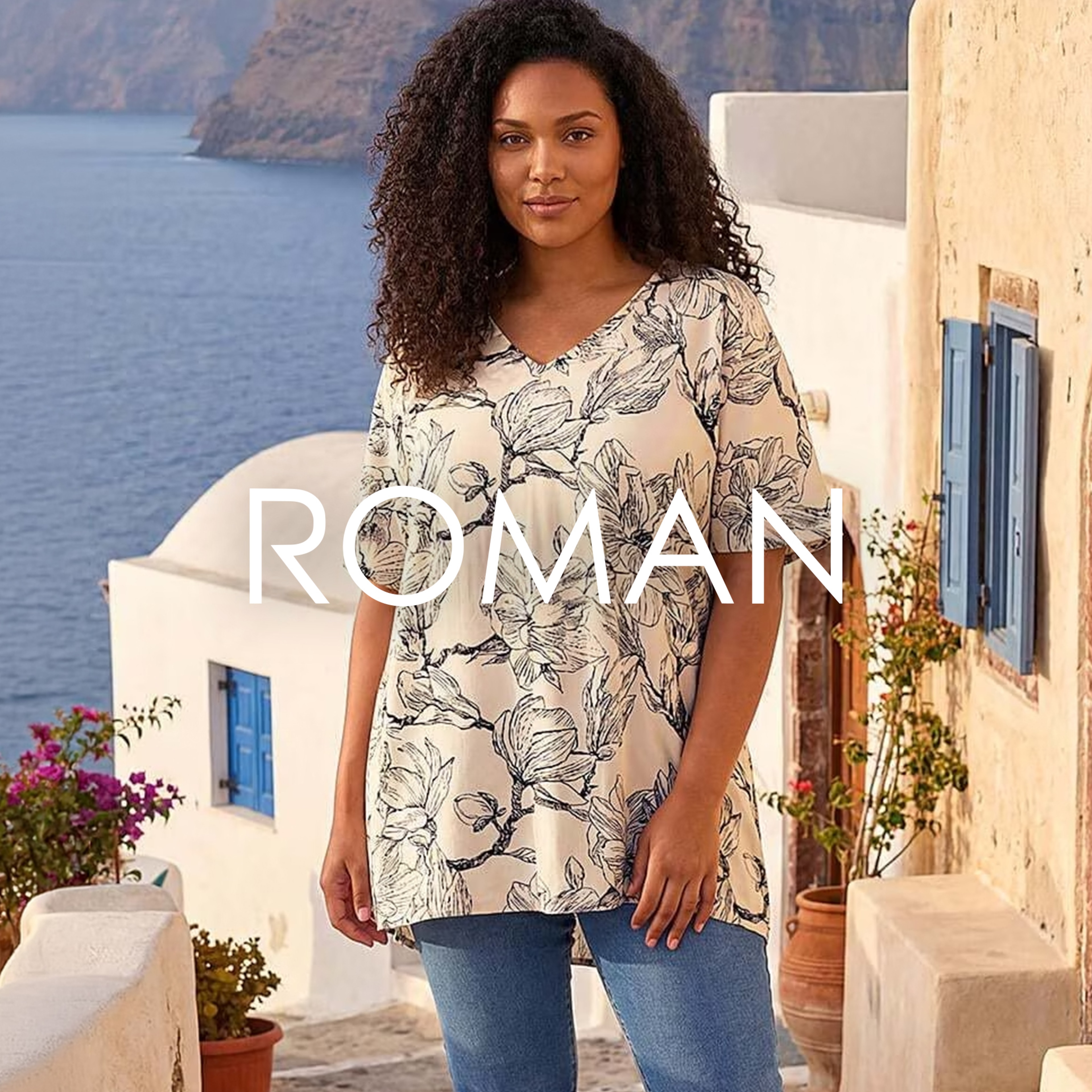 A lady wearing a ROMAN tunic top.