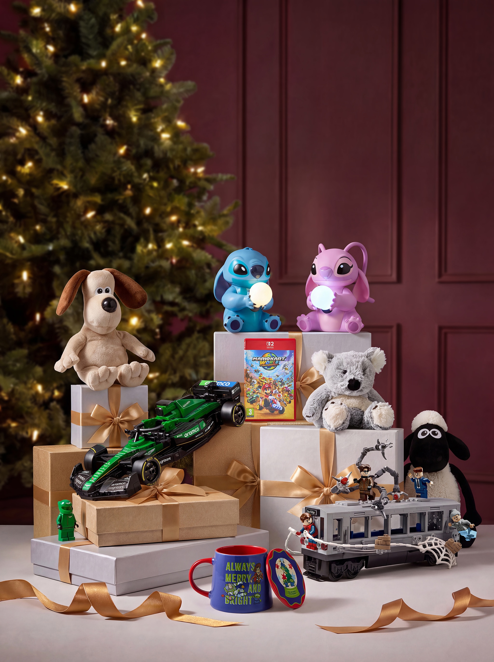 Various children's toys sat on wrapped presents on a table.
