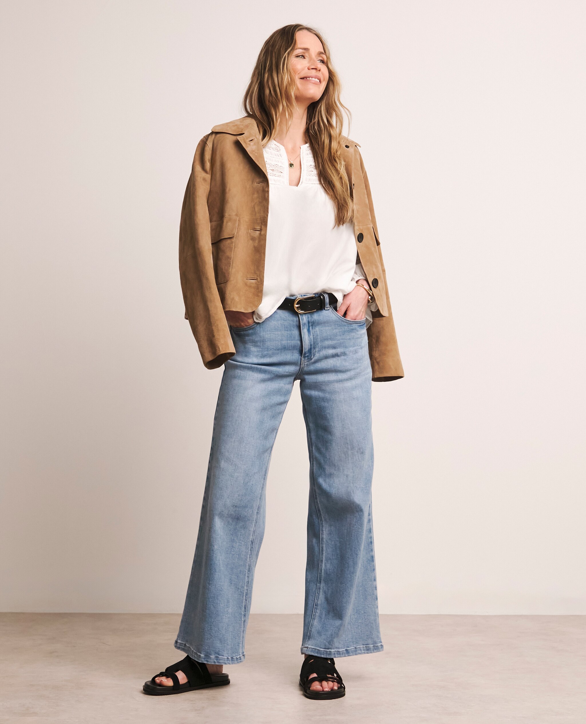 Model wears stone wash Blue Wide Leg Jeans