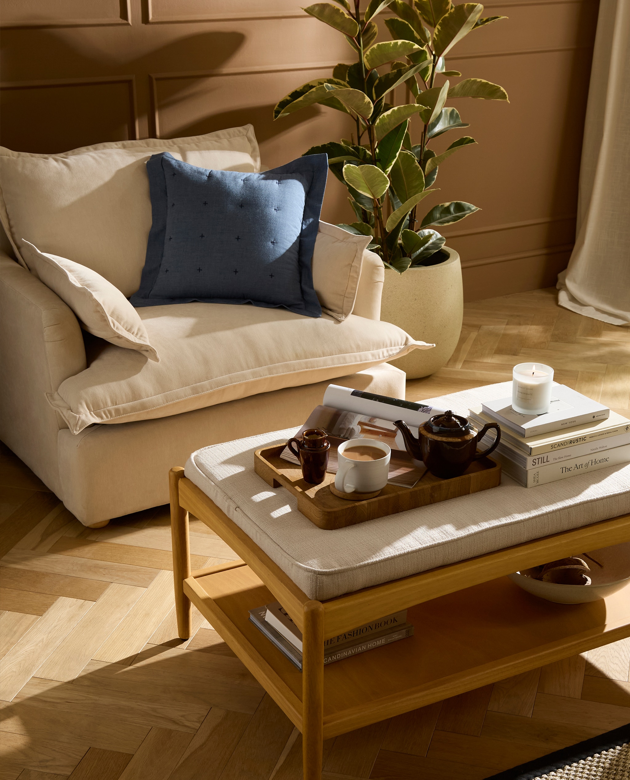 Living romm with chair in beige and coffee table