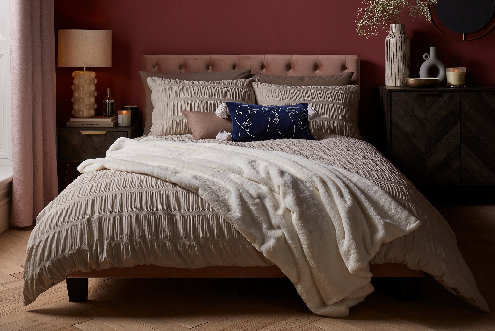 Catherine Lansfield Seersucker Duvet Cover Set is pictured with Cream Fleece throw