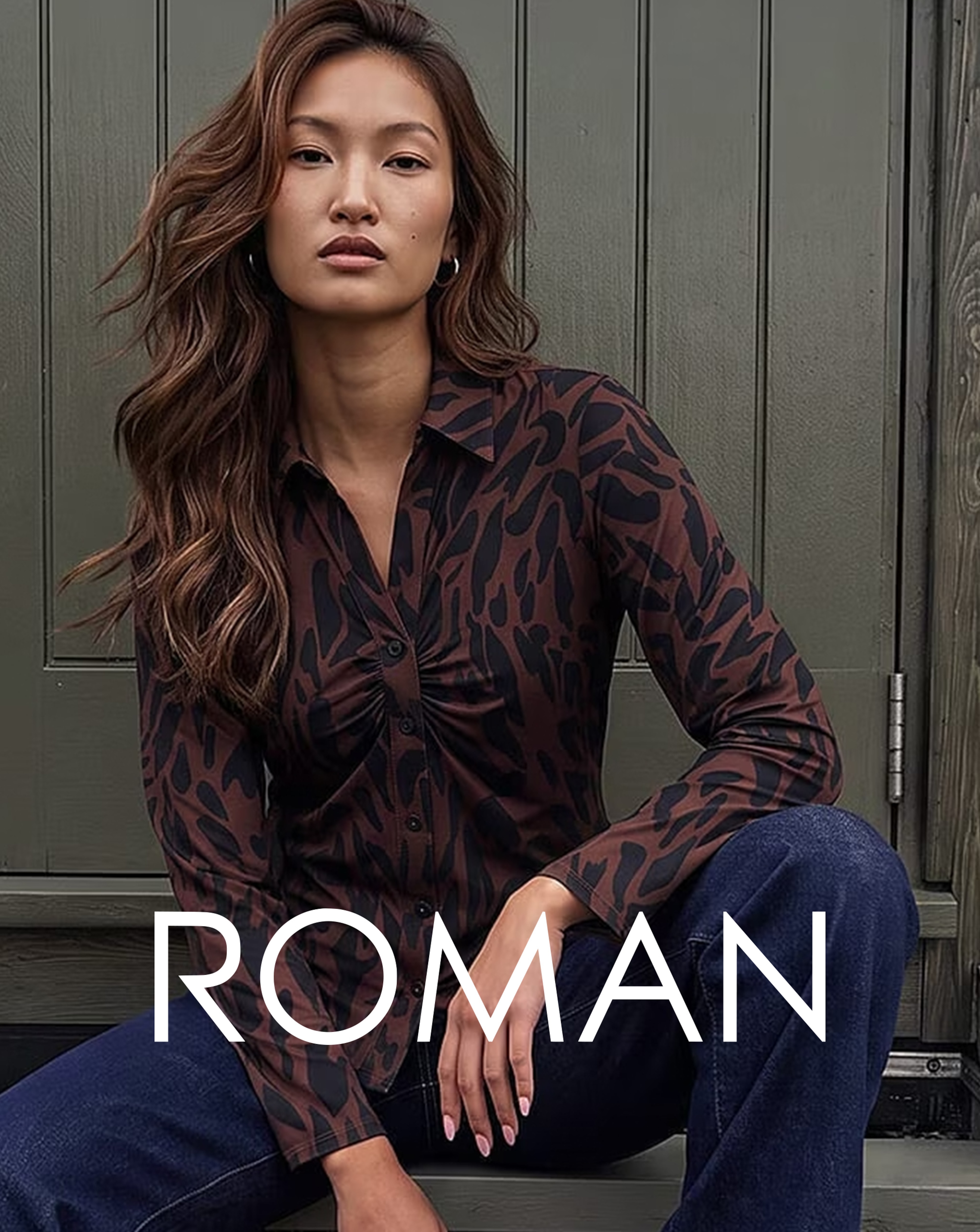 A woman wearing a a brown and black ROMAN top.