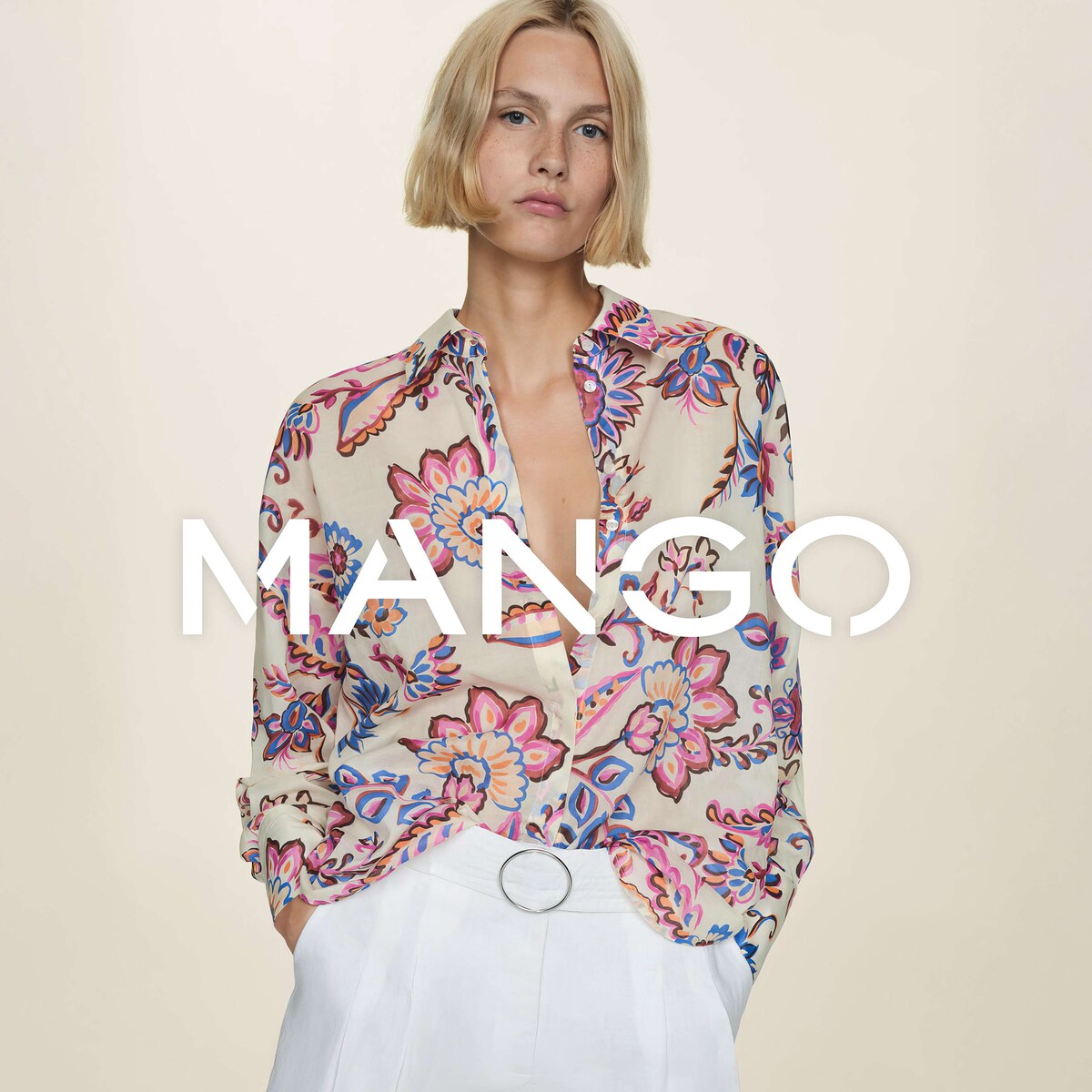 A lady wearing a flowery Mango top