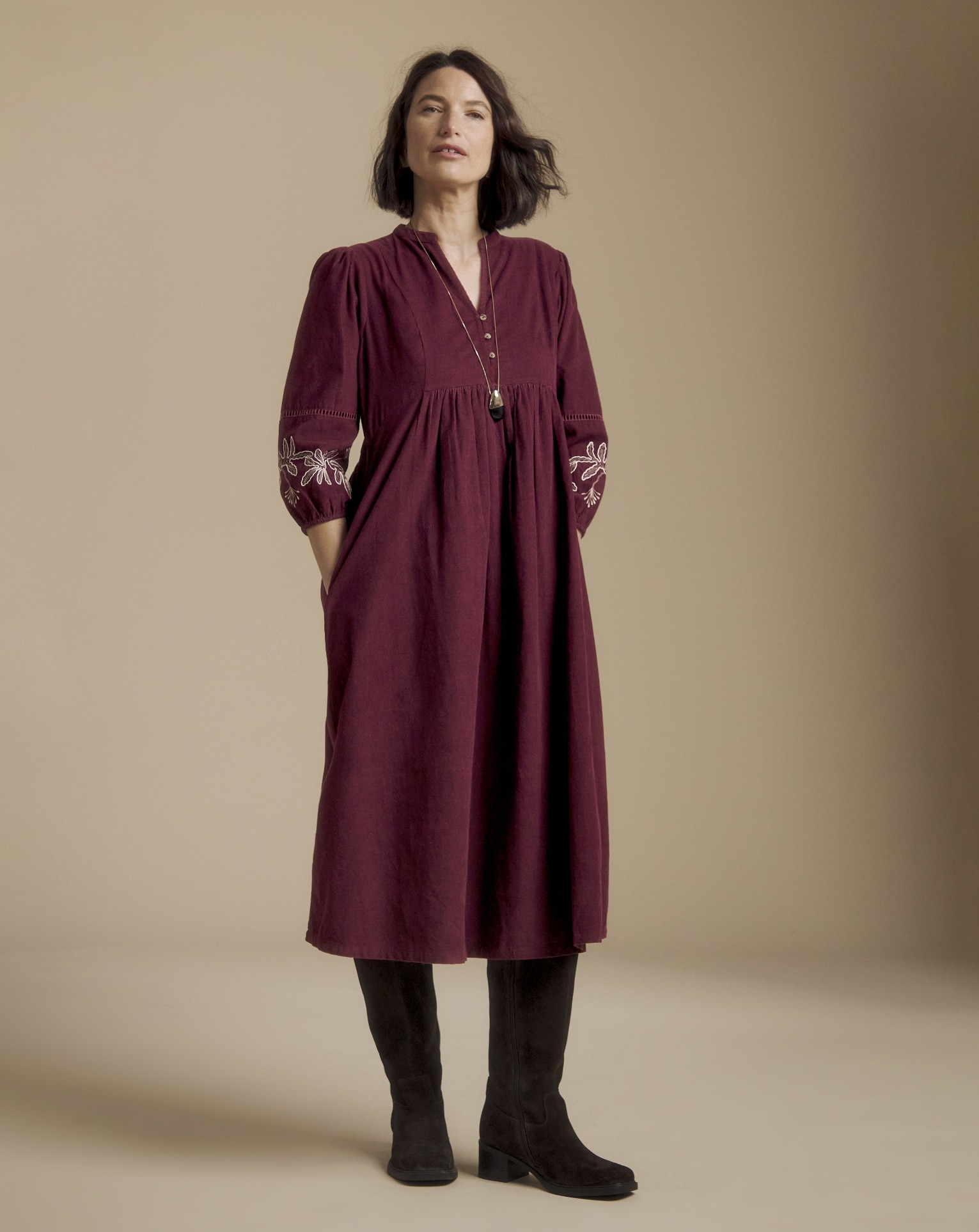 Woman wearing Julipa Embroidered Cord Midi Dress

