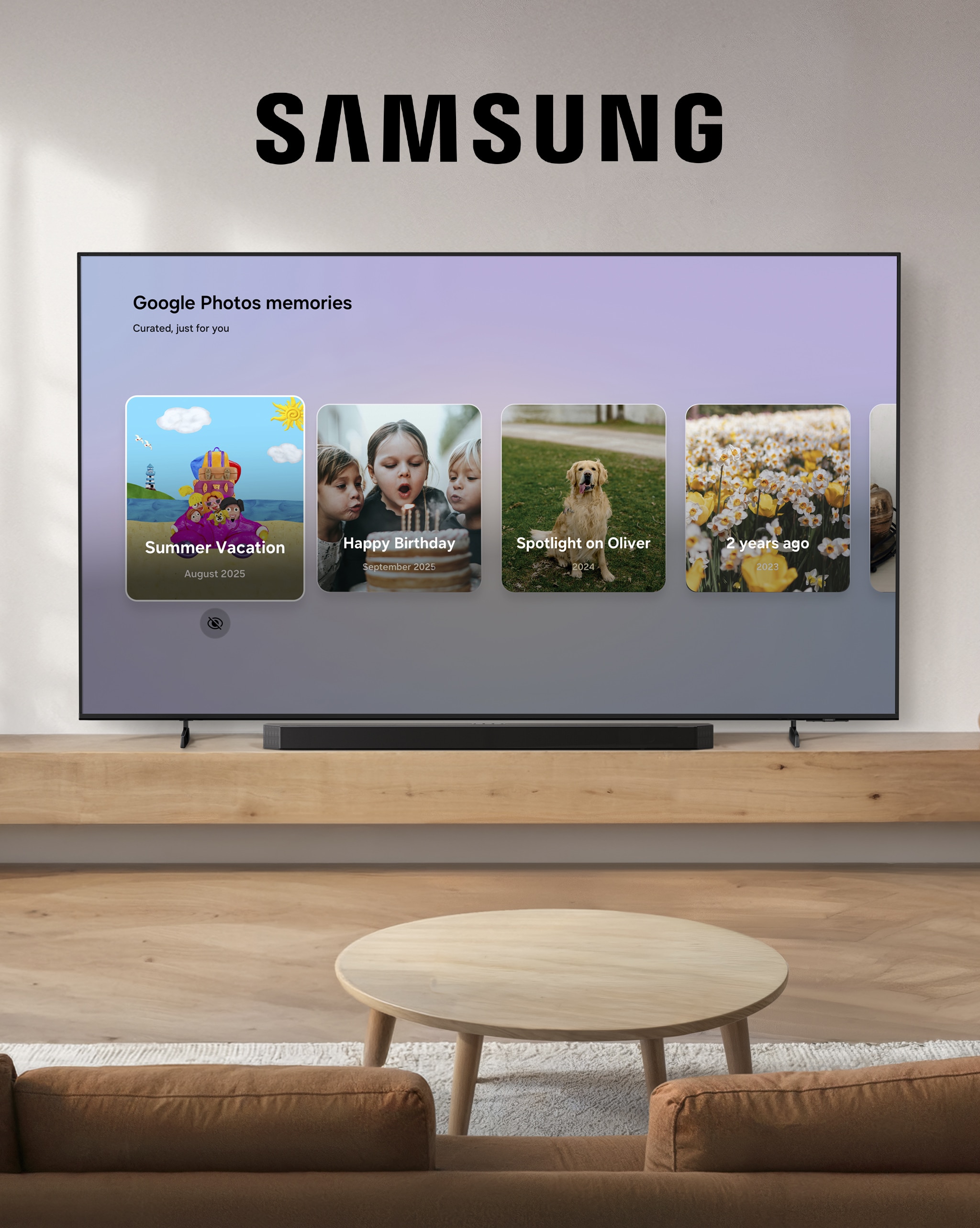 A Samsung TV stood on a table with a white wall behind.