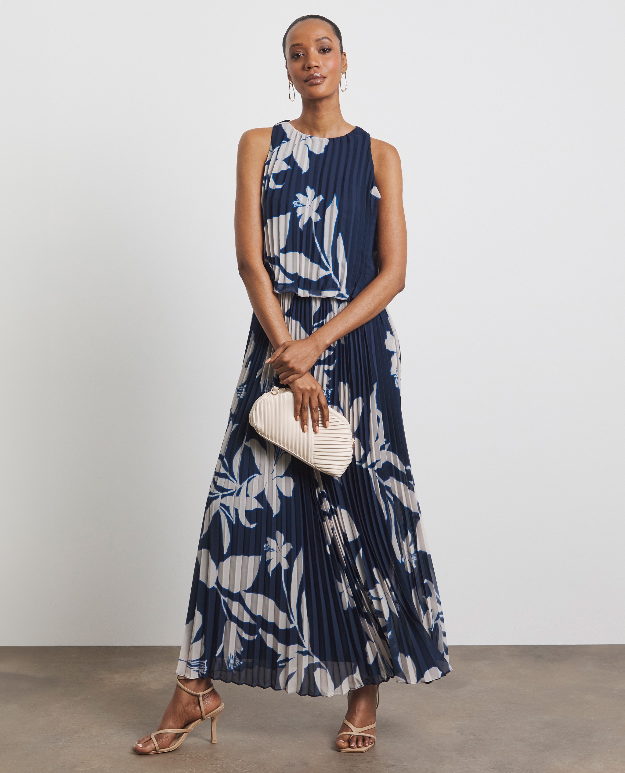 Model wearing a navy and white patterned maxi dress