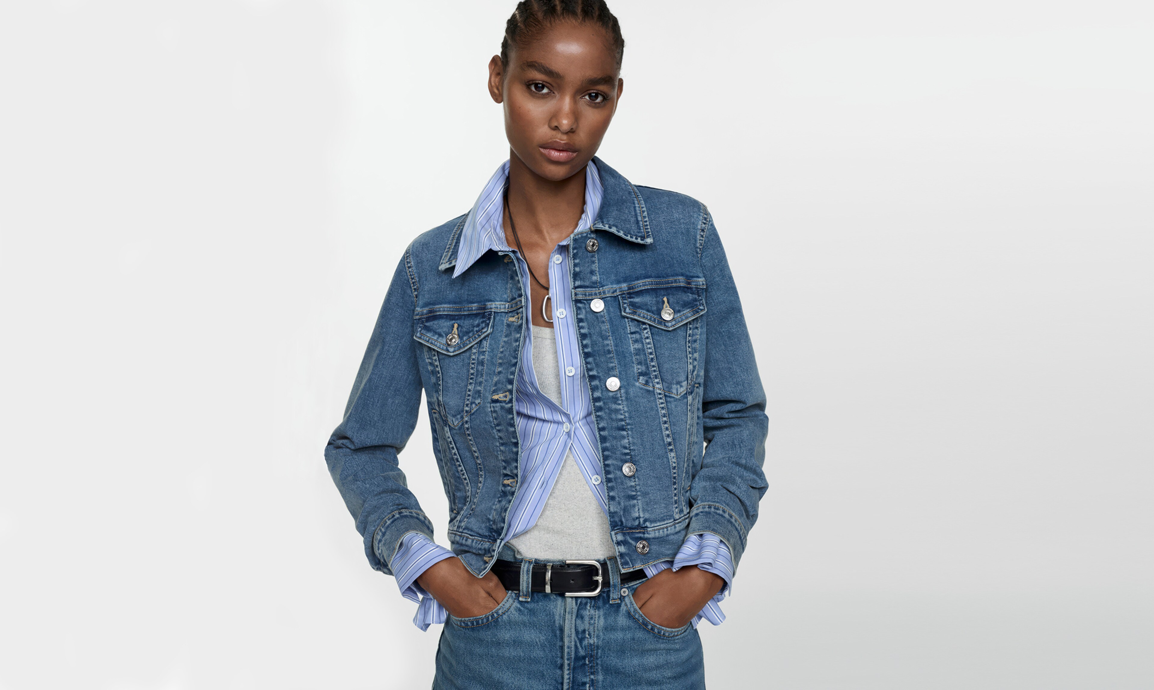 Woman wearing a denim jacket and jeans