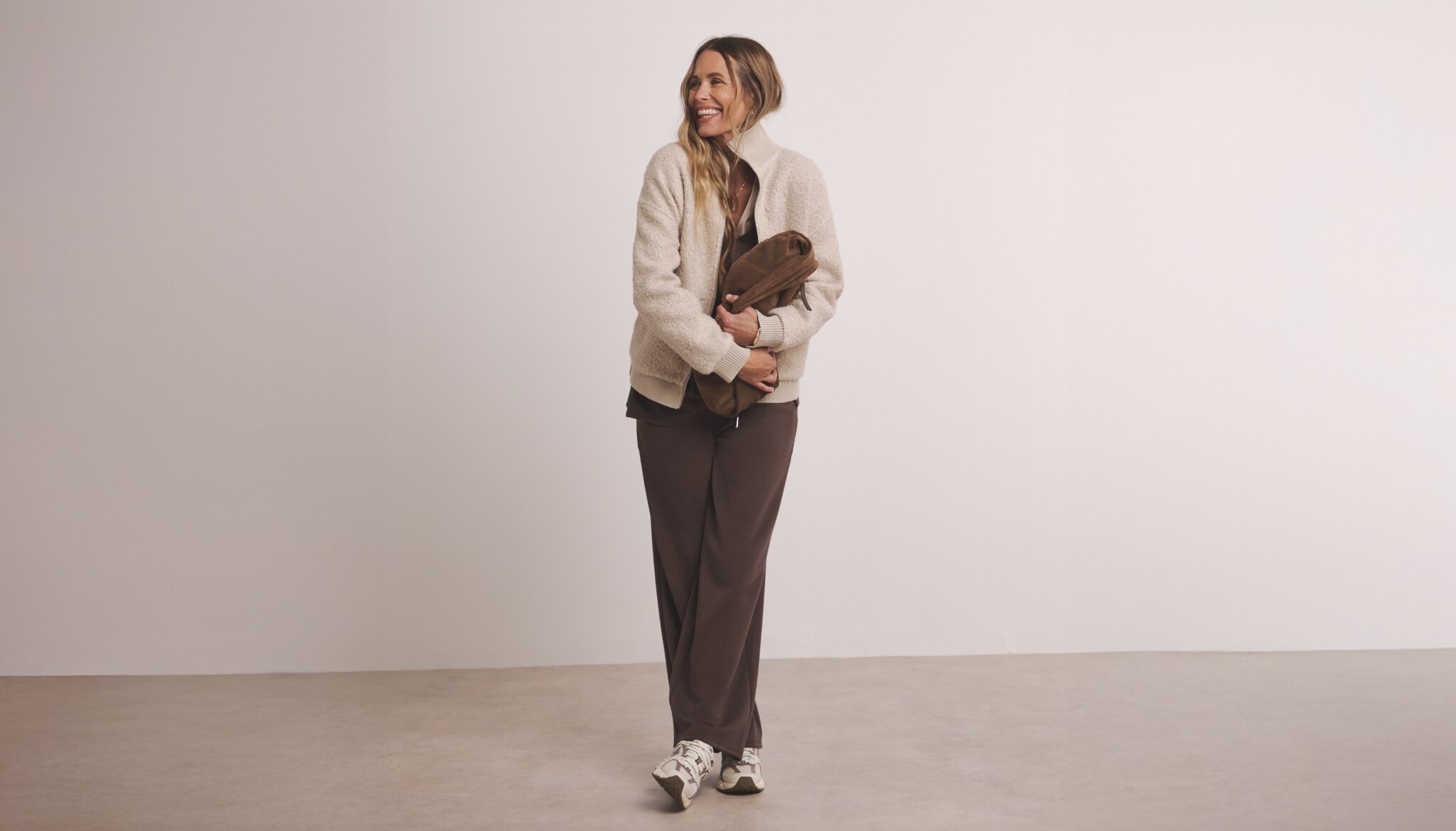 Woman wearing fleece jacket and trousers