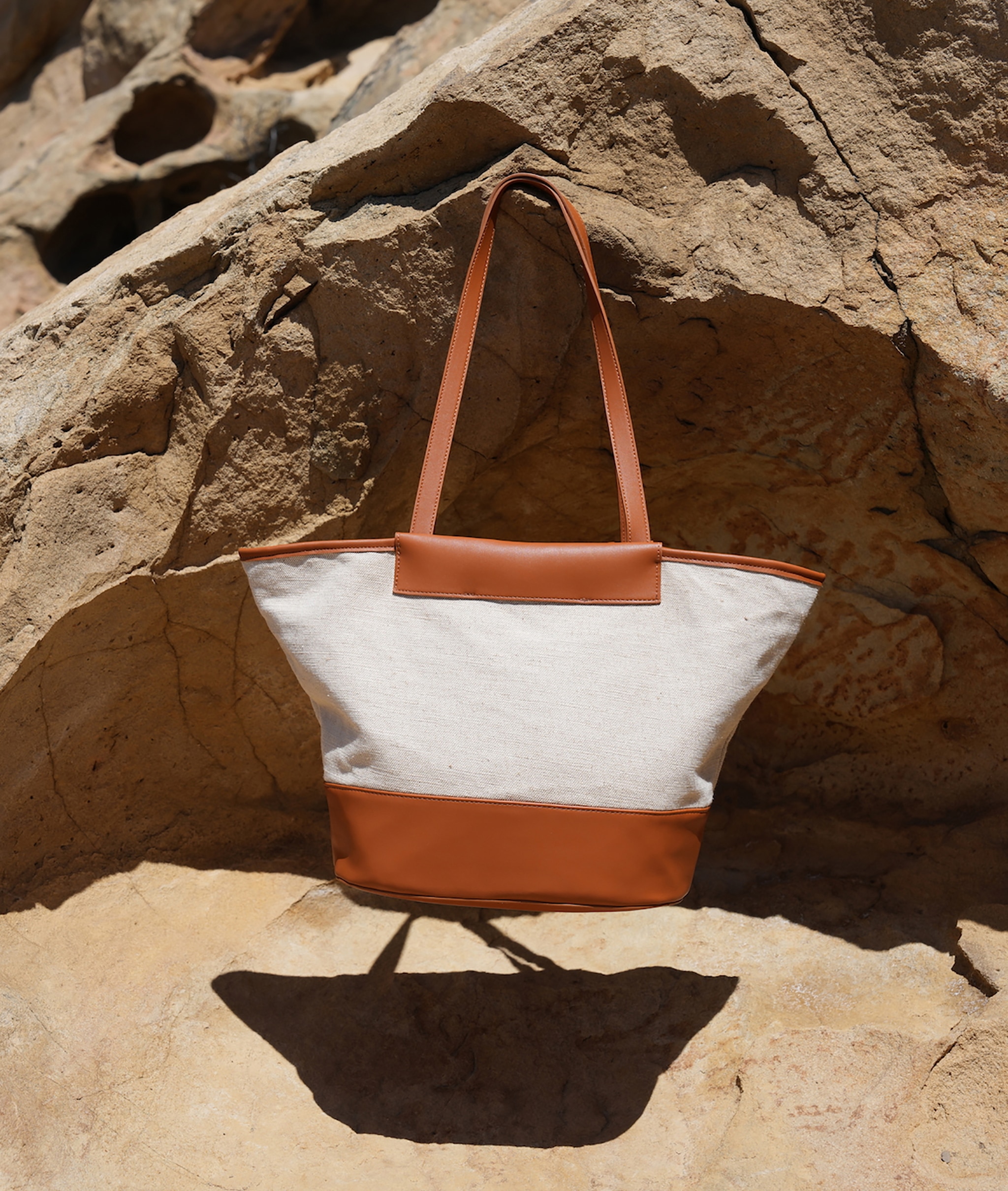 Tan leather and cream fabric beach bag
