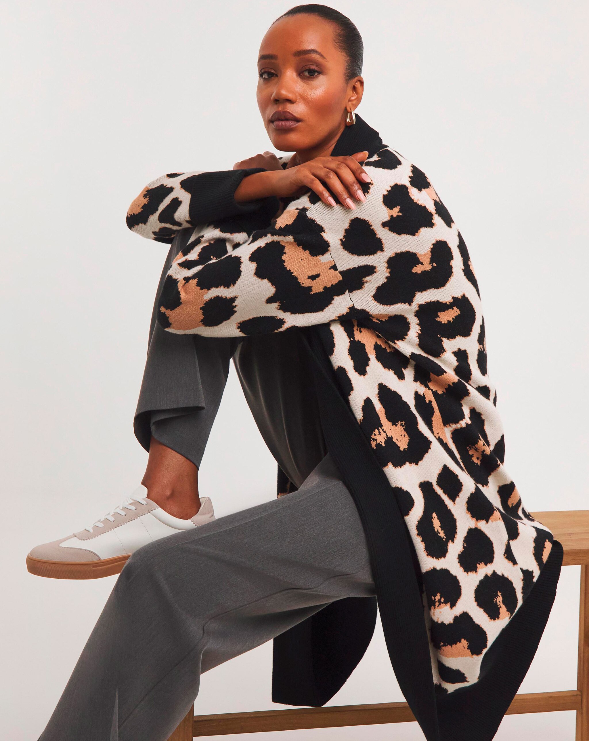 Model wearing animal print cardigan