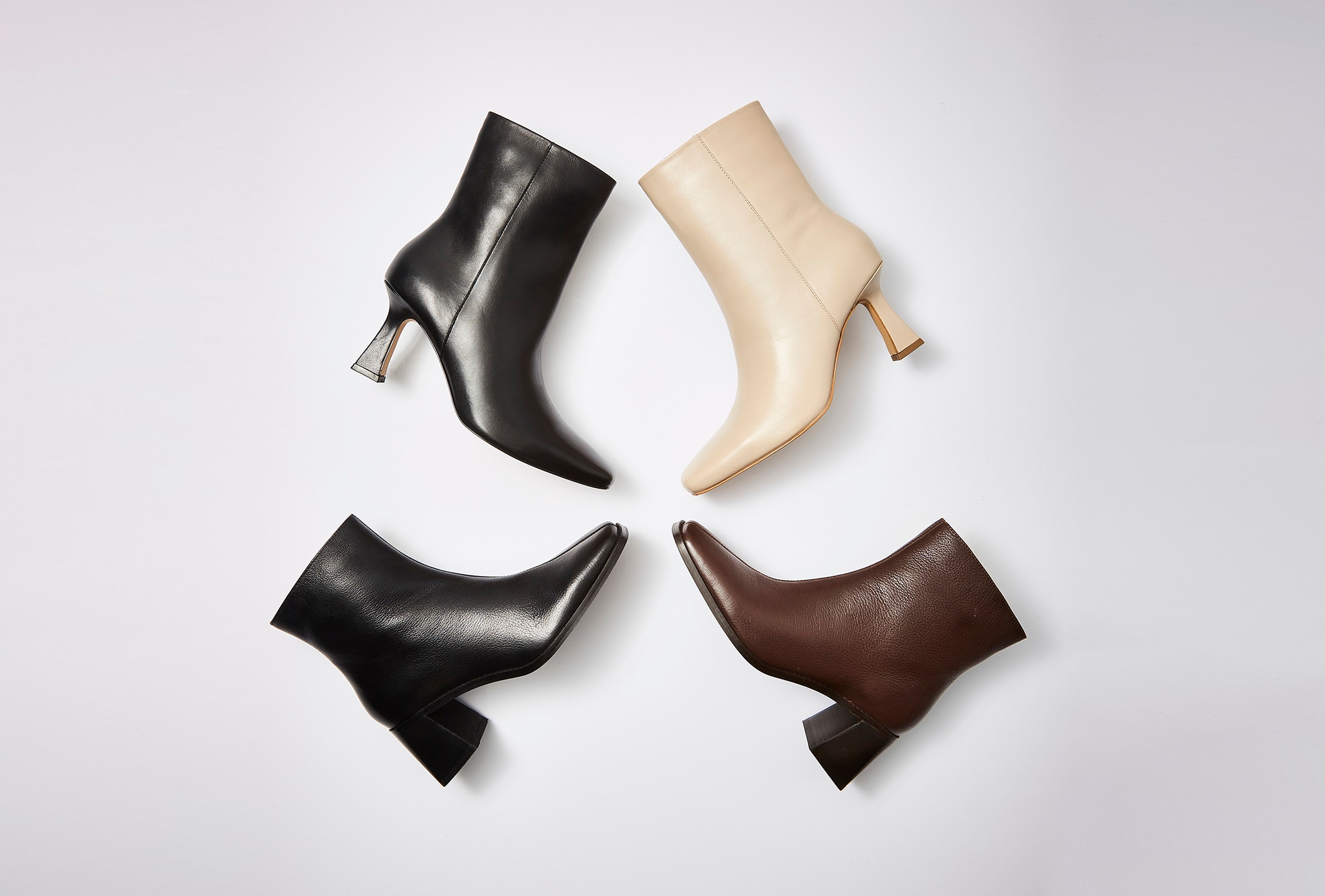A montage of 4 different coloured ankle length boots