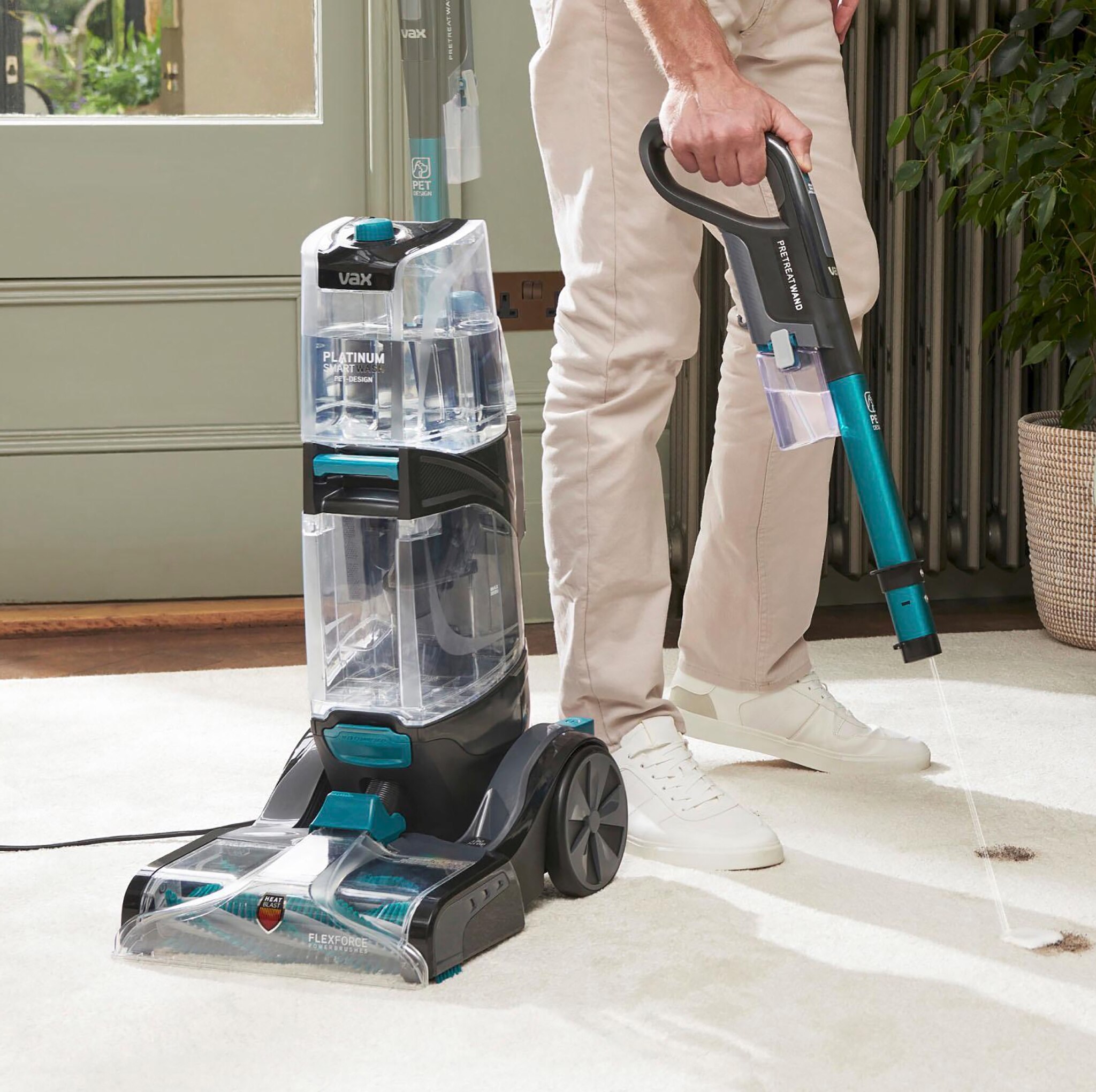 A man using a VAX Carpet
cleaner