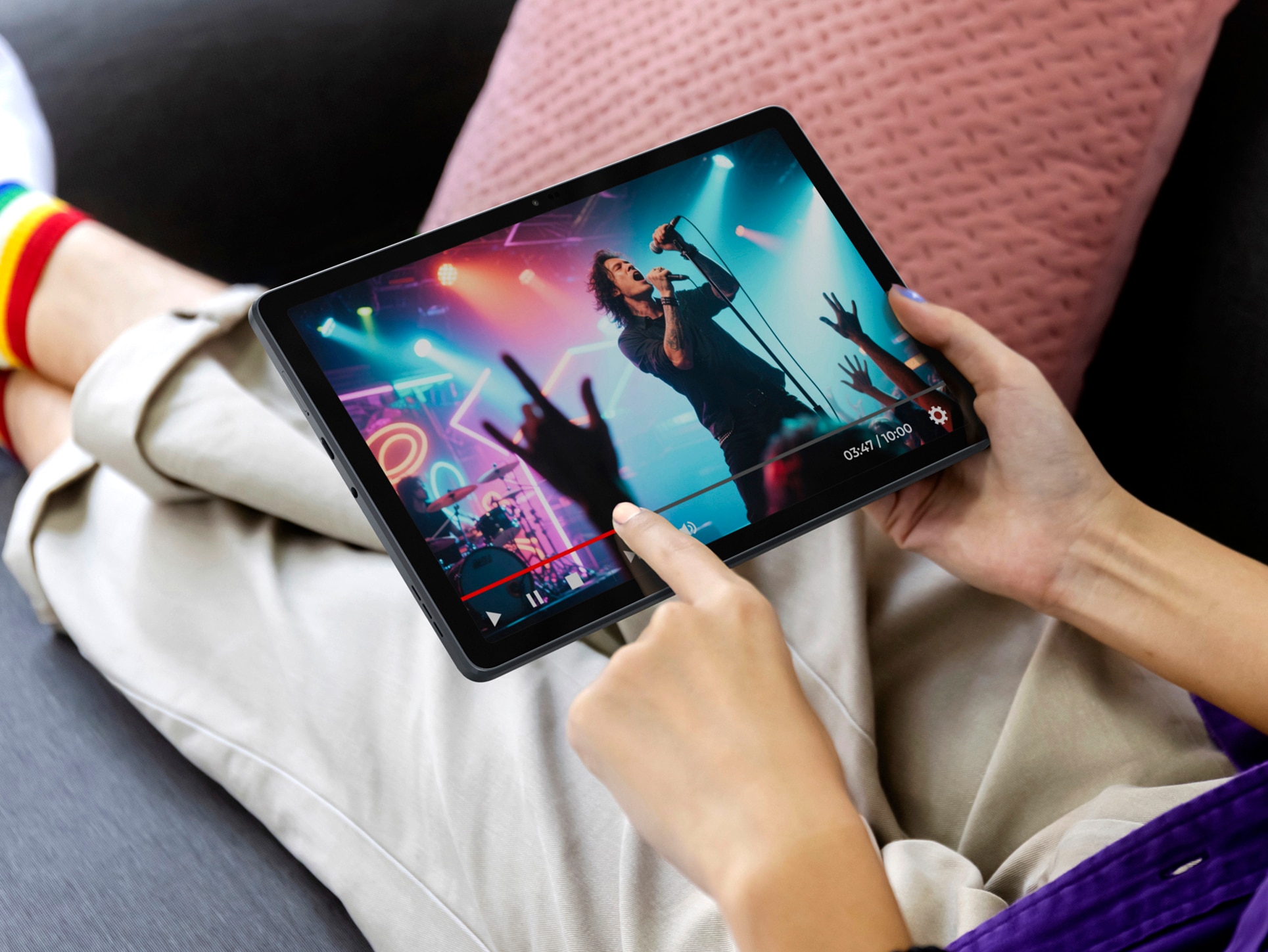 Over shoulder Girl using tablet computer on sofa in living room with blank green screen, Work from home concept.