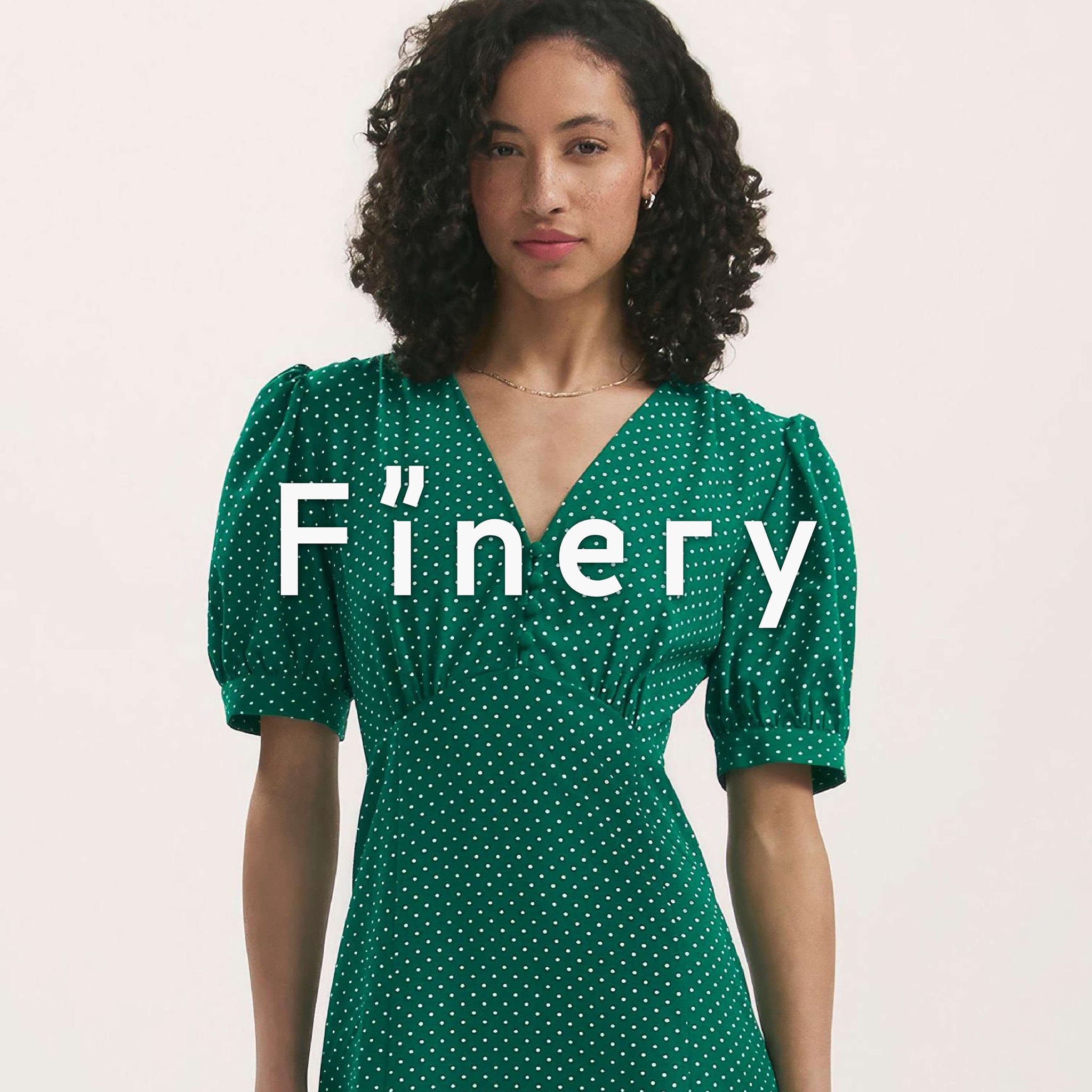 Lady wearing green Finery dress