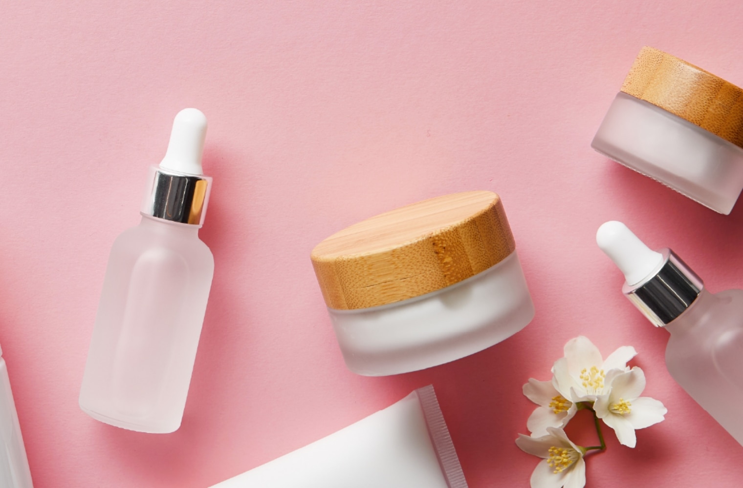 Beauty products on pink background