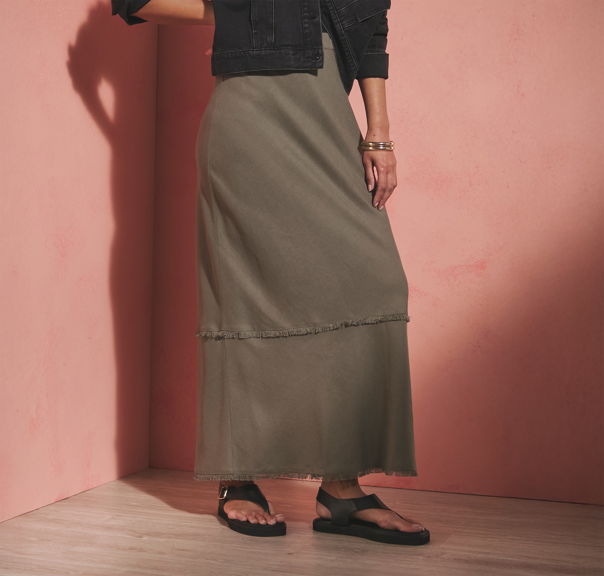 Lady wearing green linen skirt
