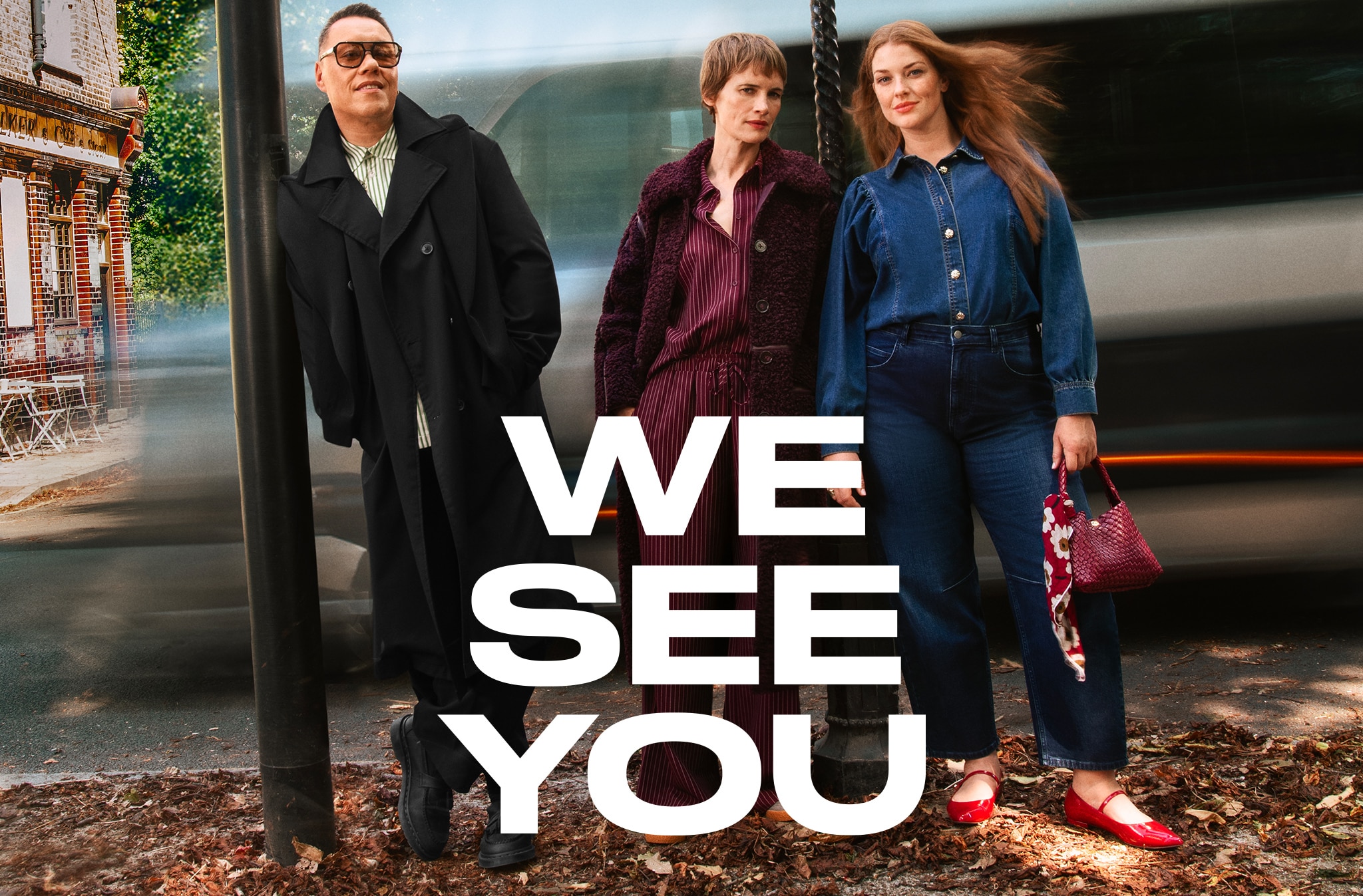 Gok Wan and two ladies stood next to a road with traffic moving behind. We see you text slogan overlaid on top of the image.