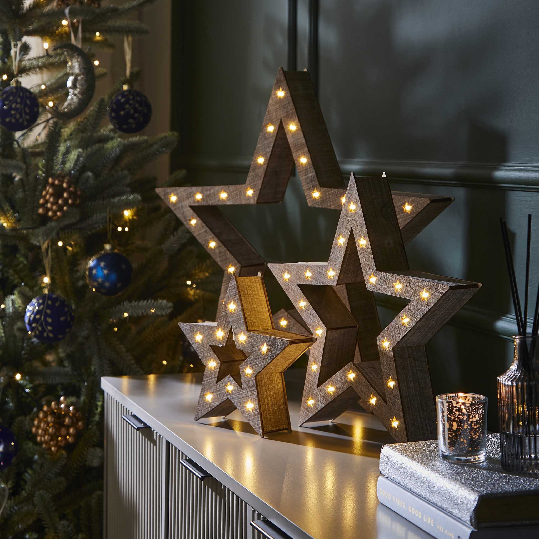 Two light up star Christmas decorations