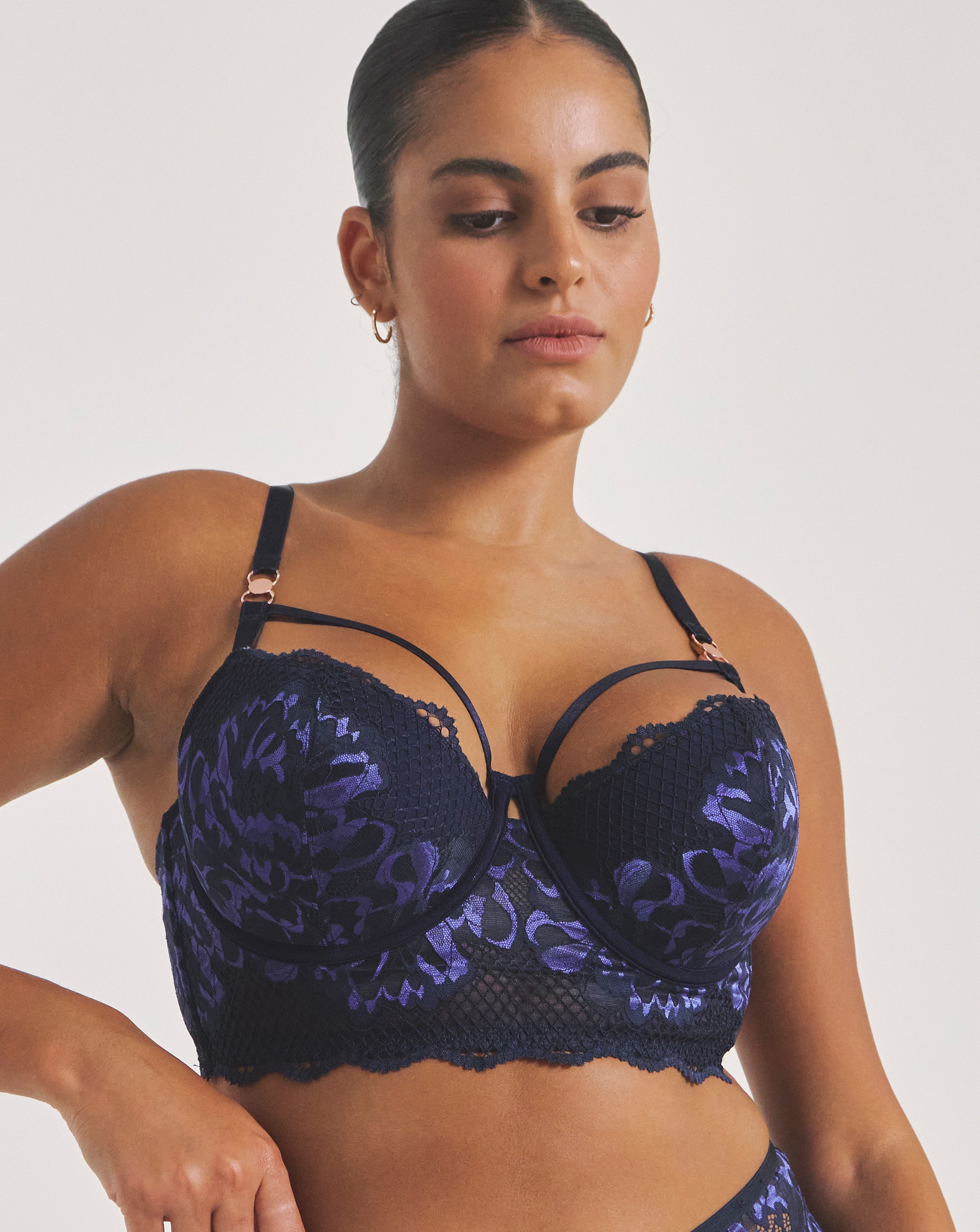 Model wearing a navy blue Amore padded balcony wired bra