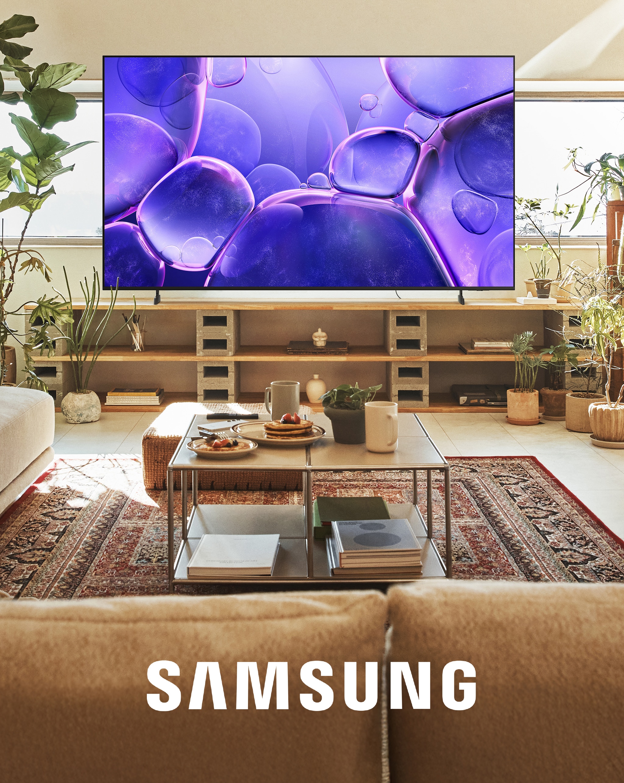 A Samsung TV in a beige sandy coloured living room.