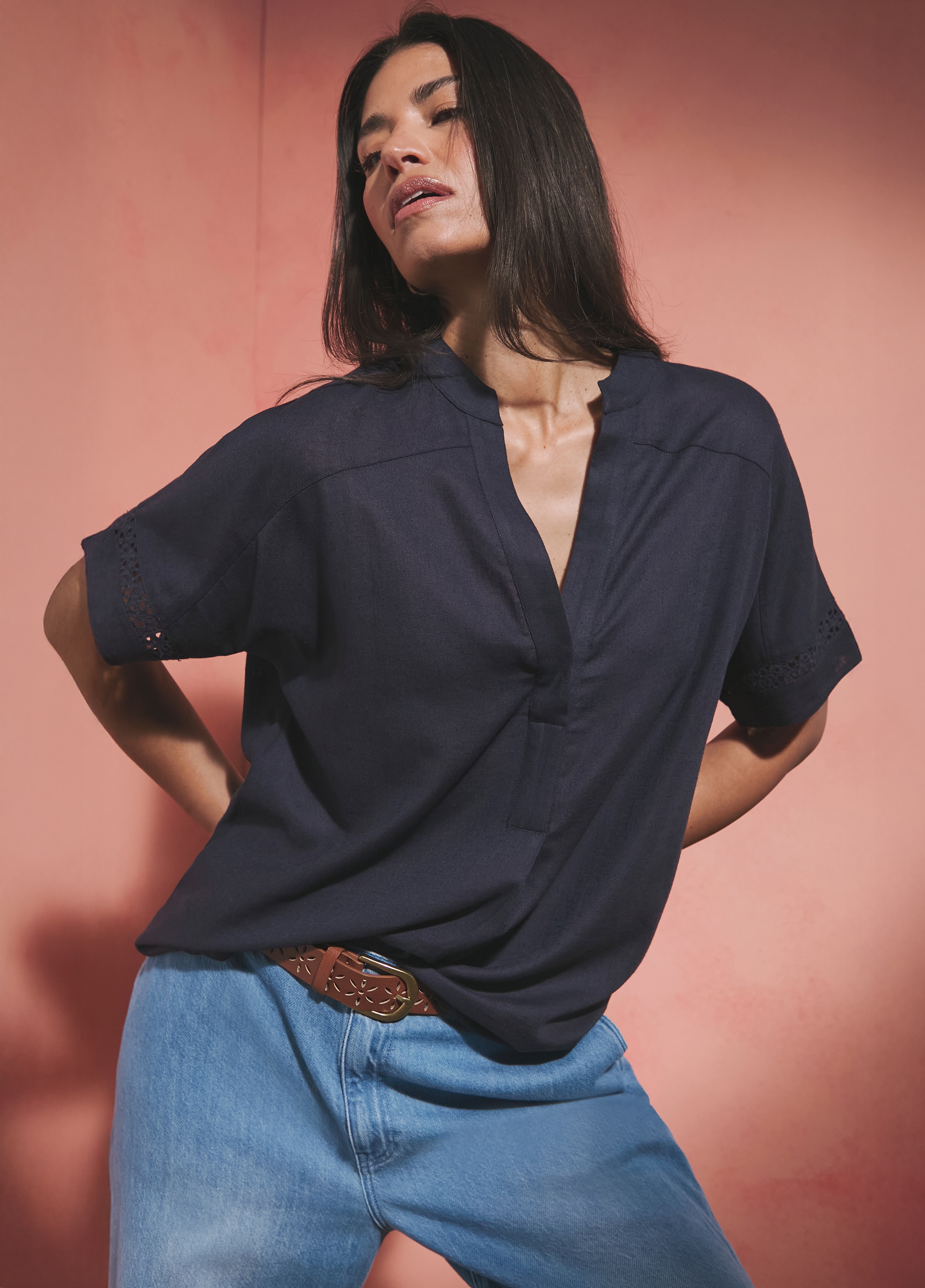 Lady wearing a navy blue v neck top