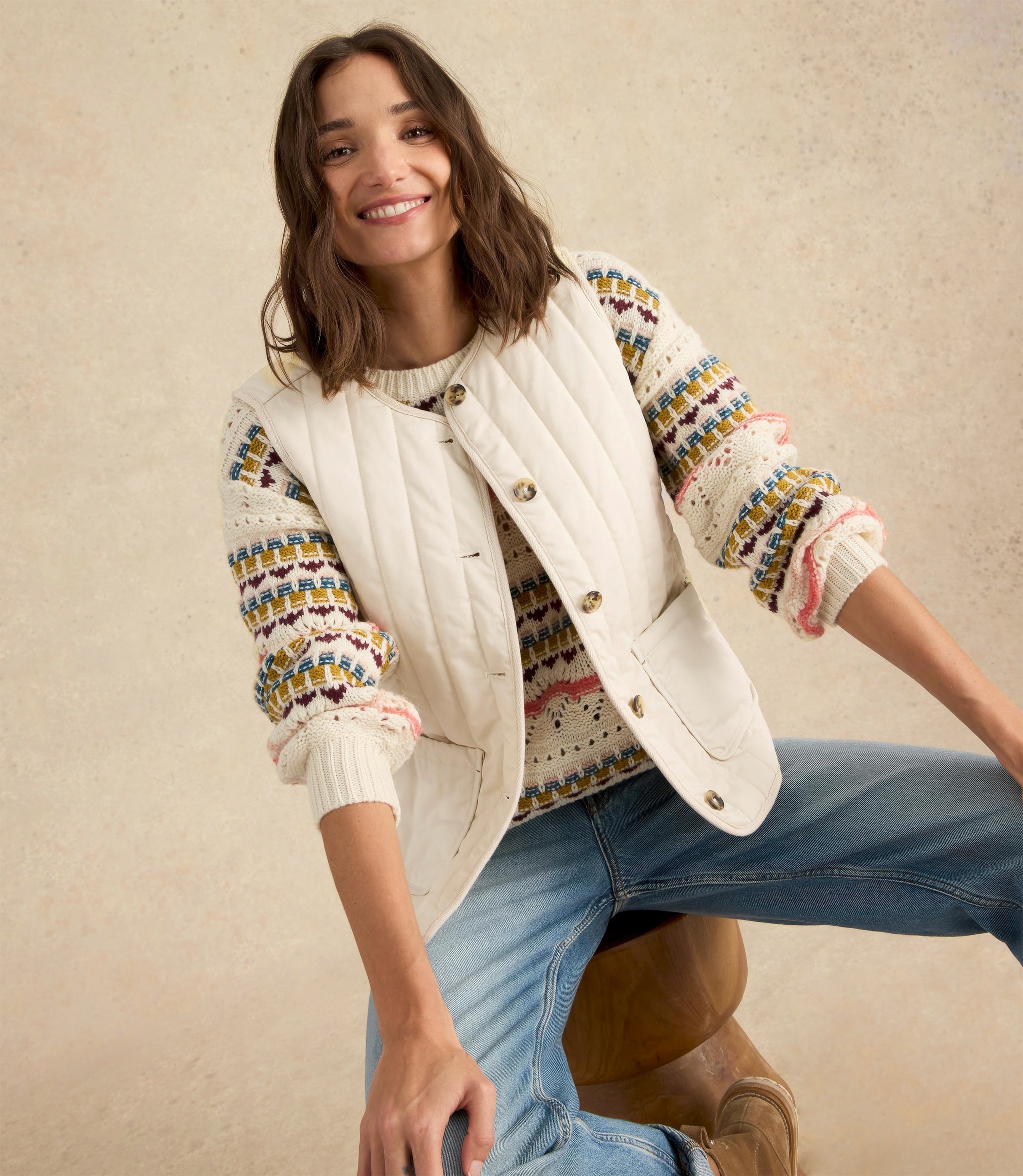 Lady wearing White Stuff Emma quilted gilet