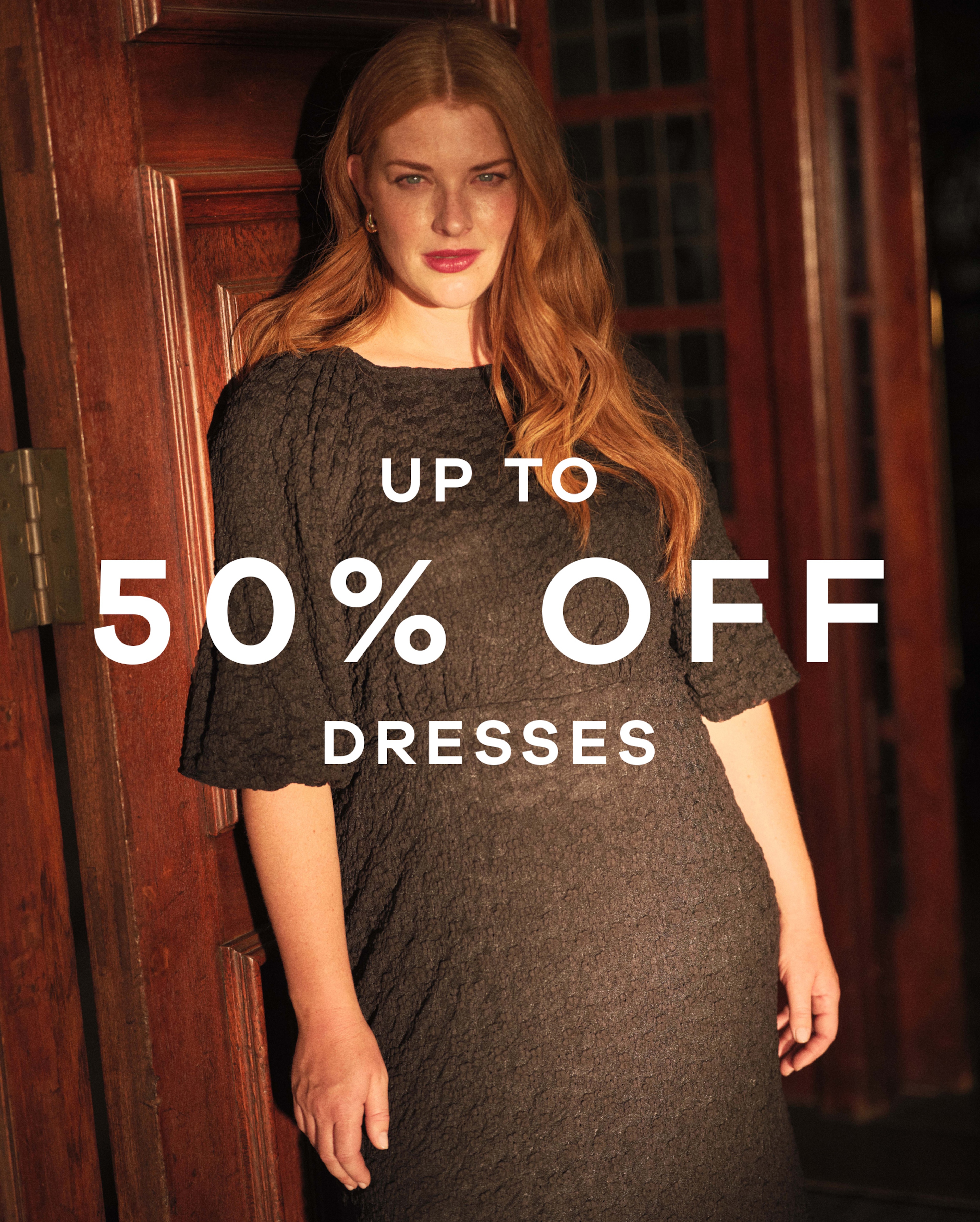 Up to 50% off dresses text overlaid on an image of a lady wearing a black dress.