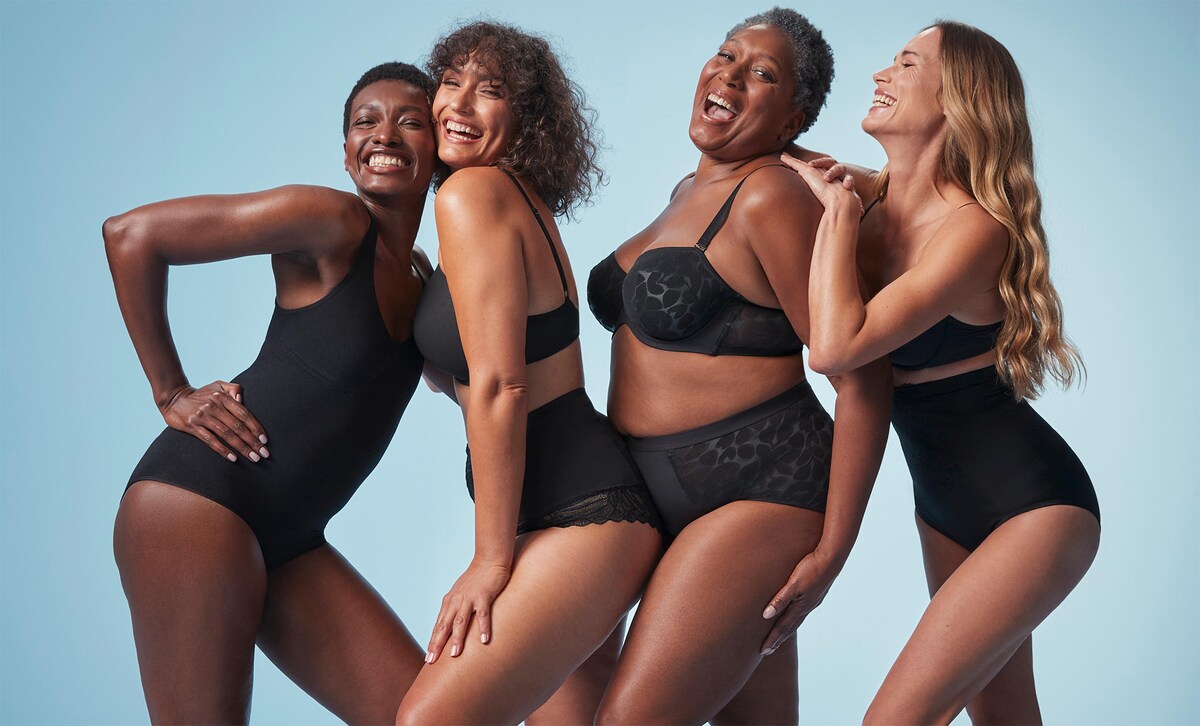 Group of ladies stood up wearing black Magisculpt underwear