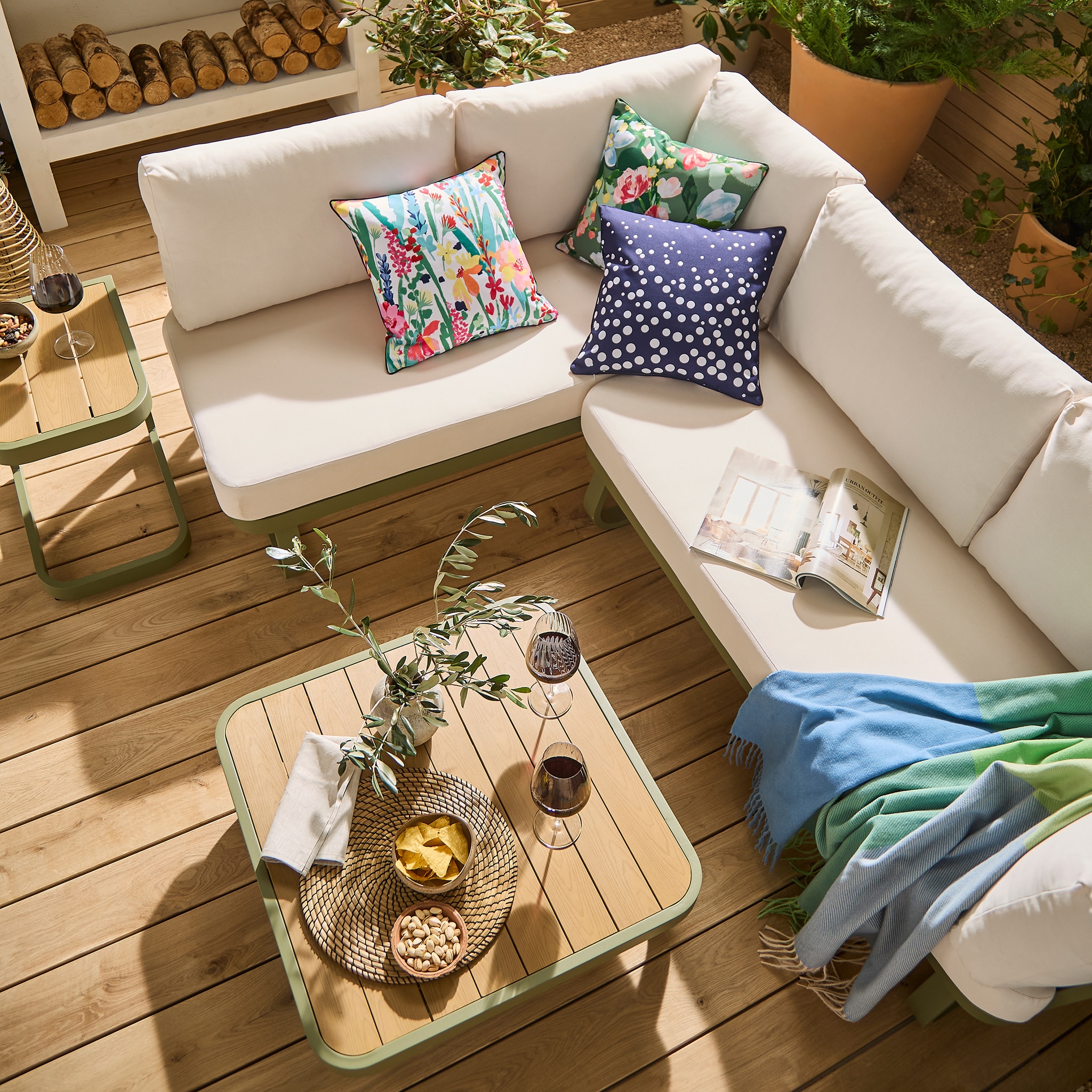 A garden patio featuring the Genoa green corner sofa set.